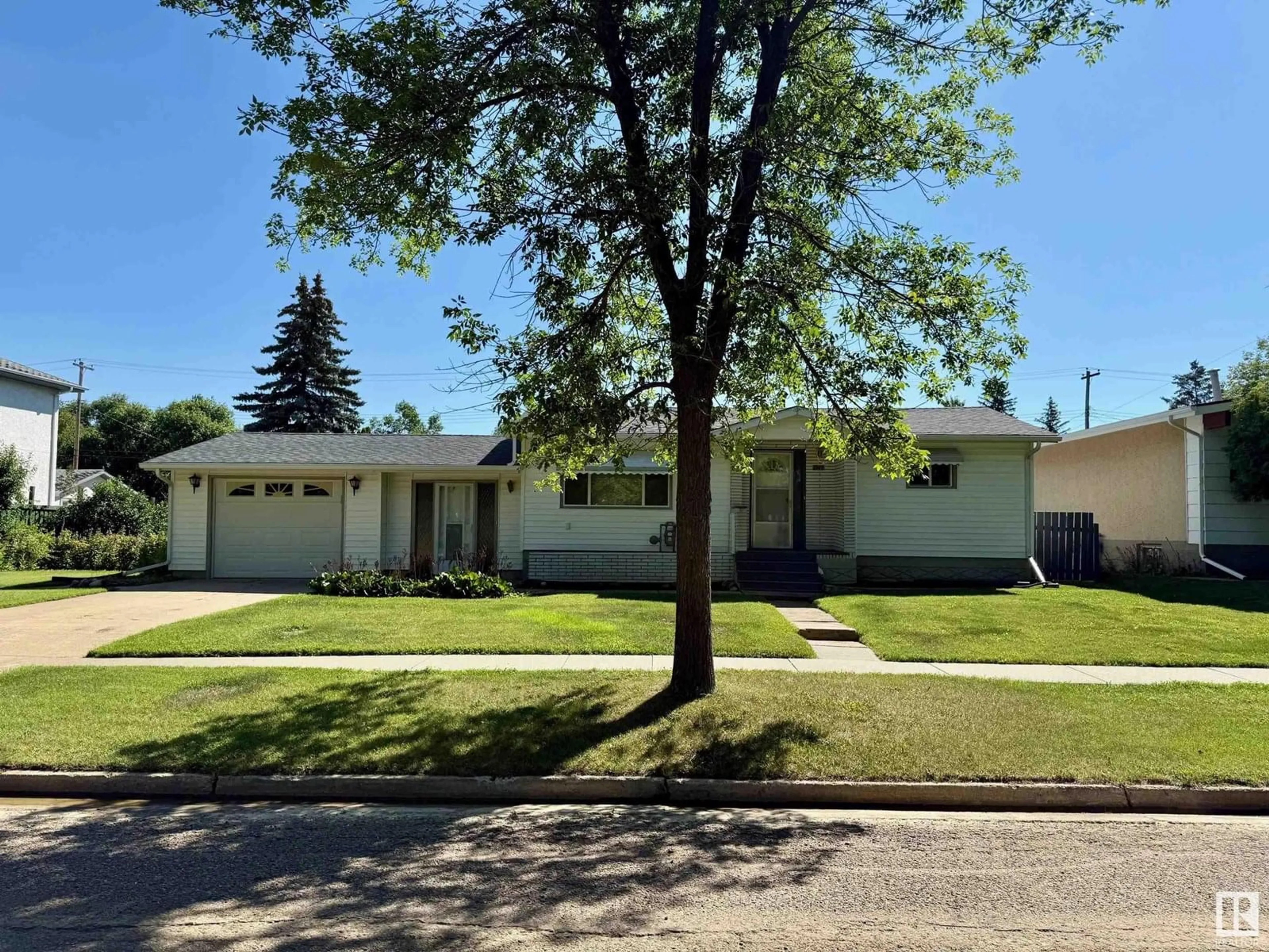 Home with vinyl exterior material, street for 5211 51 ST, Redwater Alberta T0A2W0