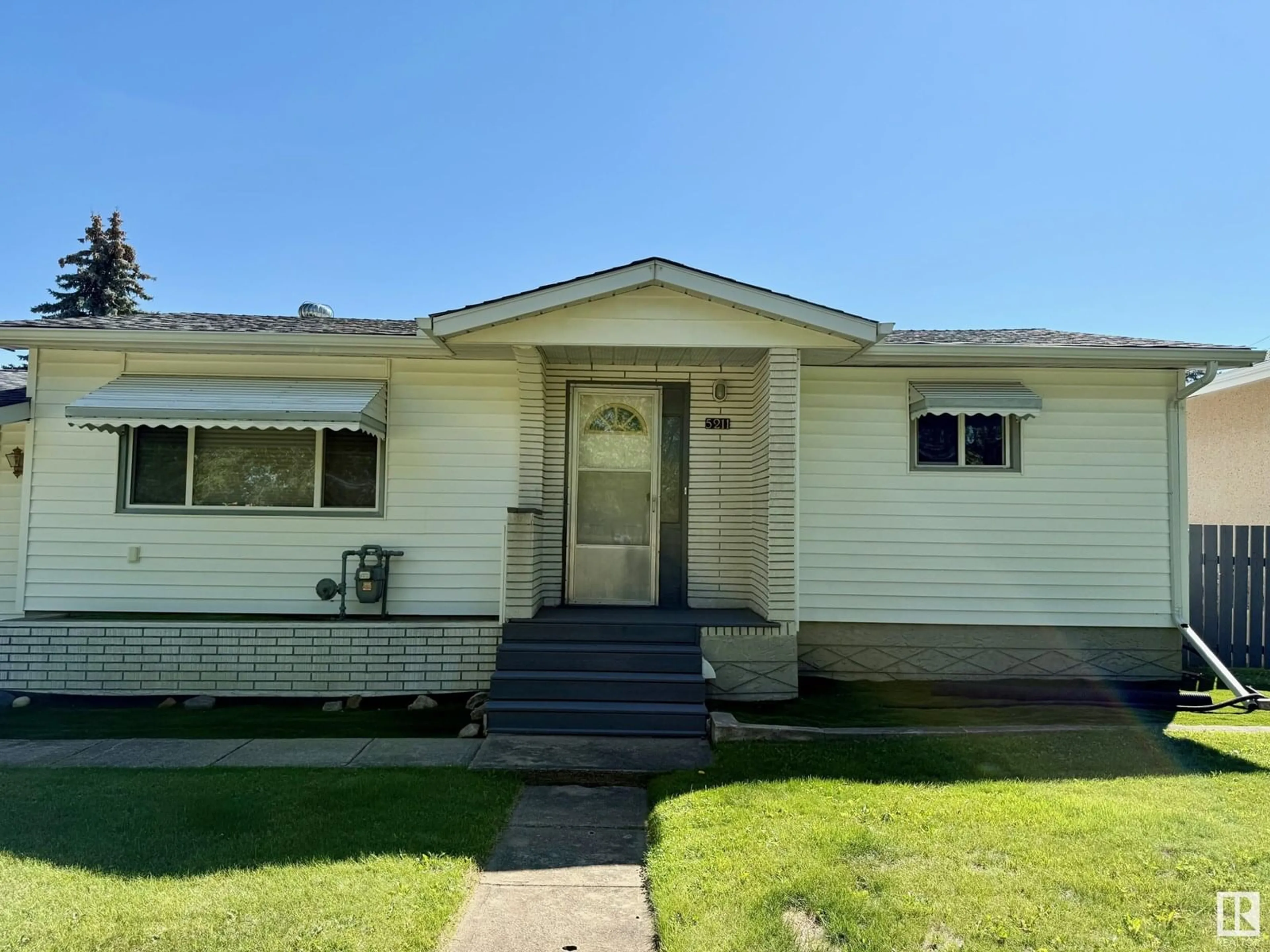 Home with vinyl exterior material, street for 5211 51 ST, Redwater Alberta T0A2W0
