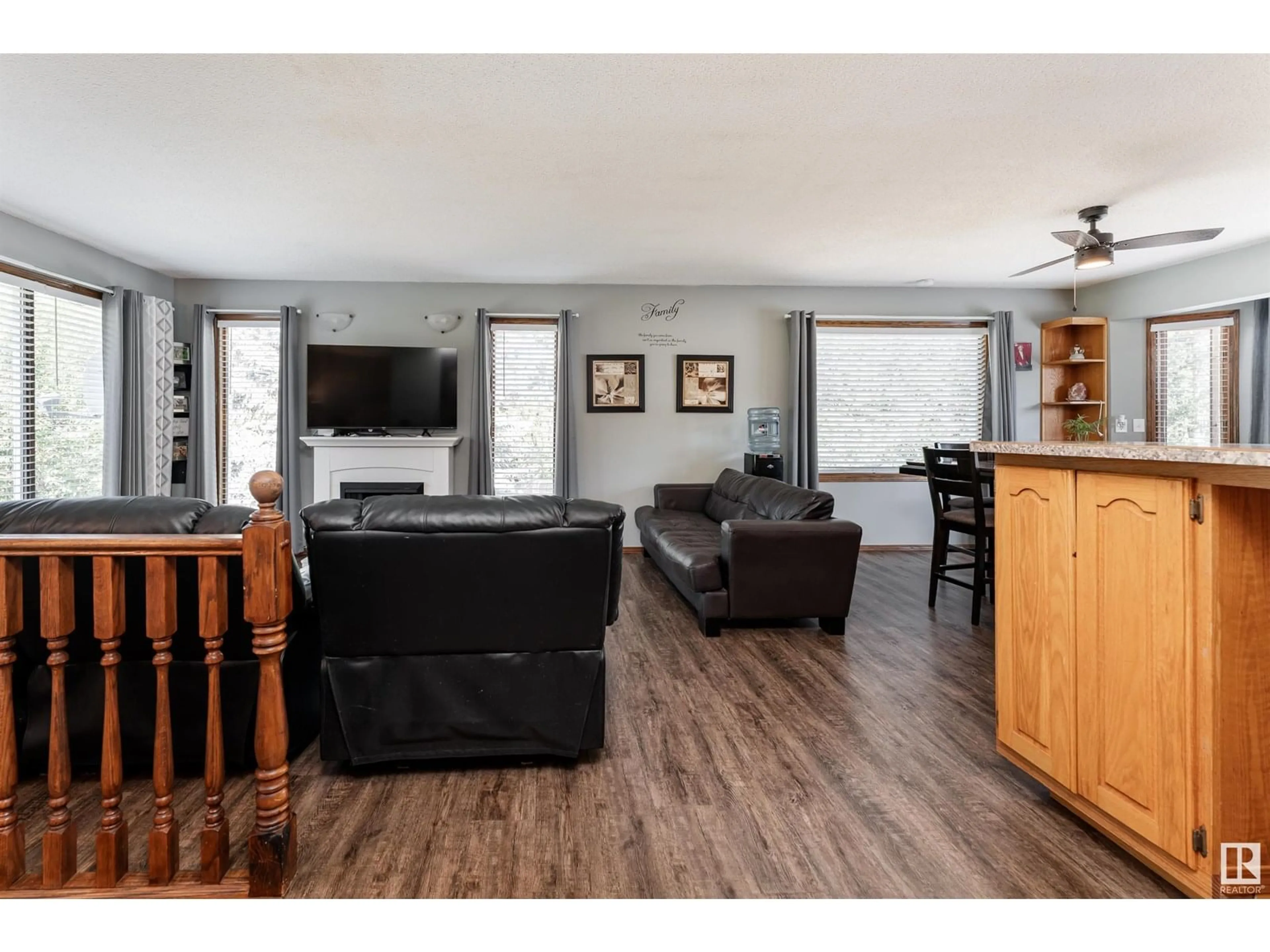 Living room with furniture, wood/laminate floor for #4 - 2228 PARKLAND DR, Rural Parkland County Alberta T7Y2L2