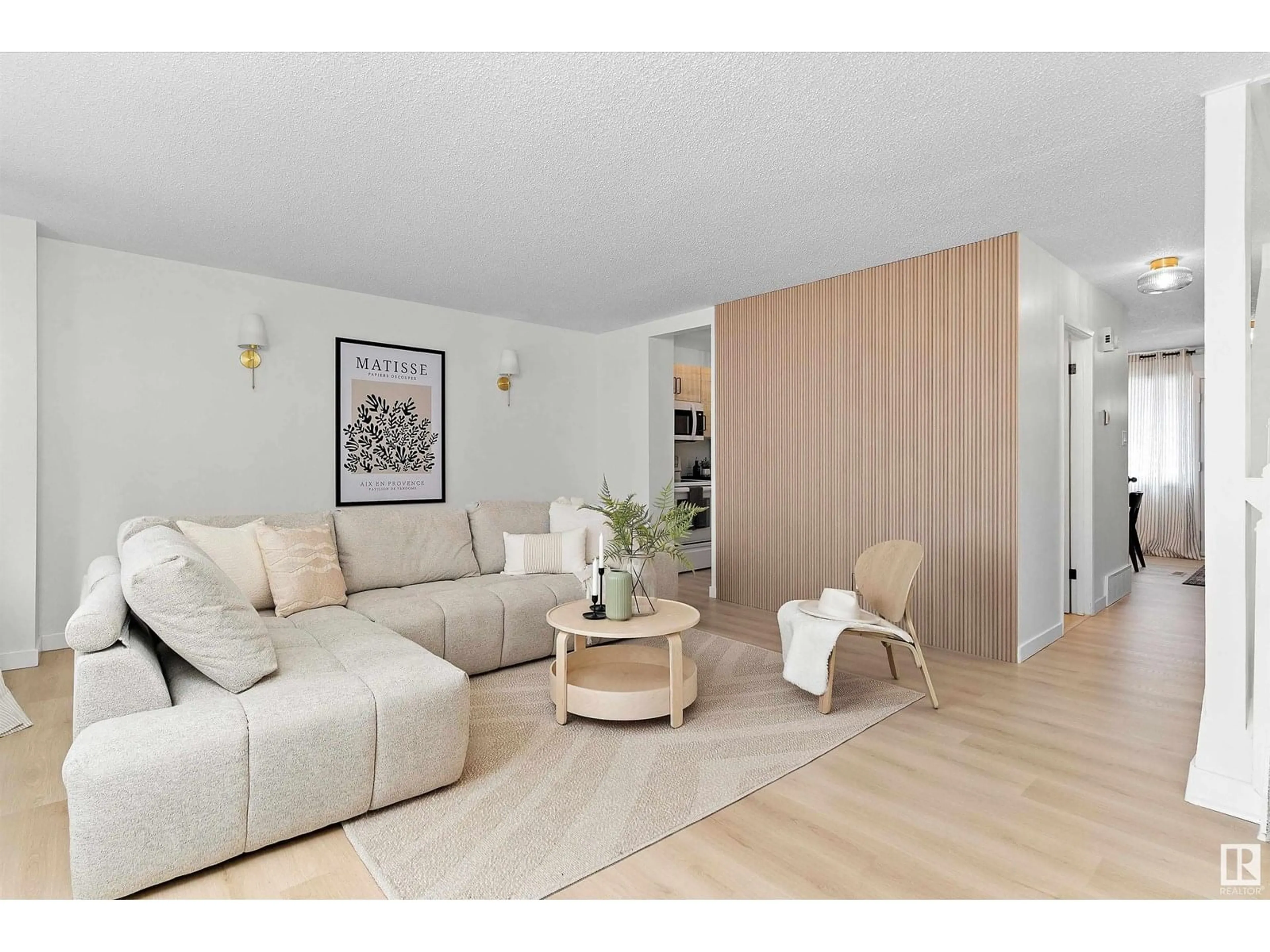 Living room with furniture, wood/laminate floor for 717 VILLAGE ON THE GREEN GR, Edmonton Alberta T5A1H2