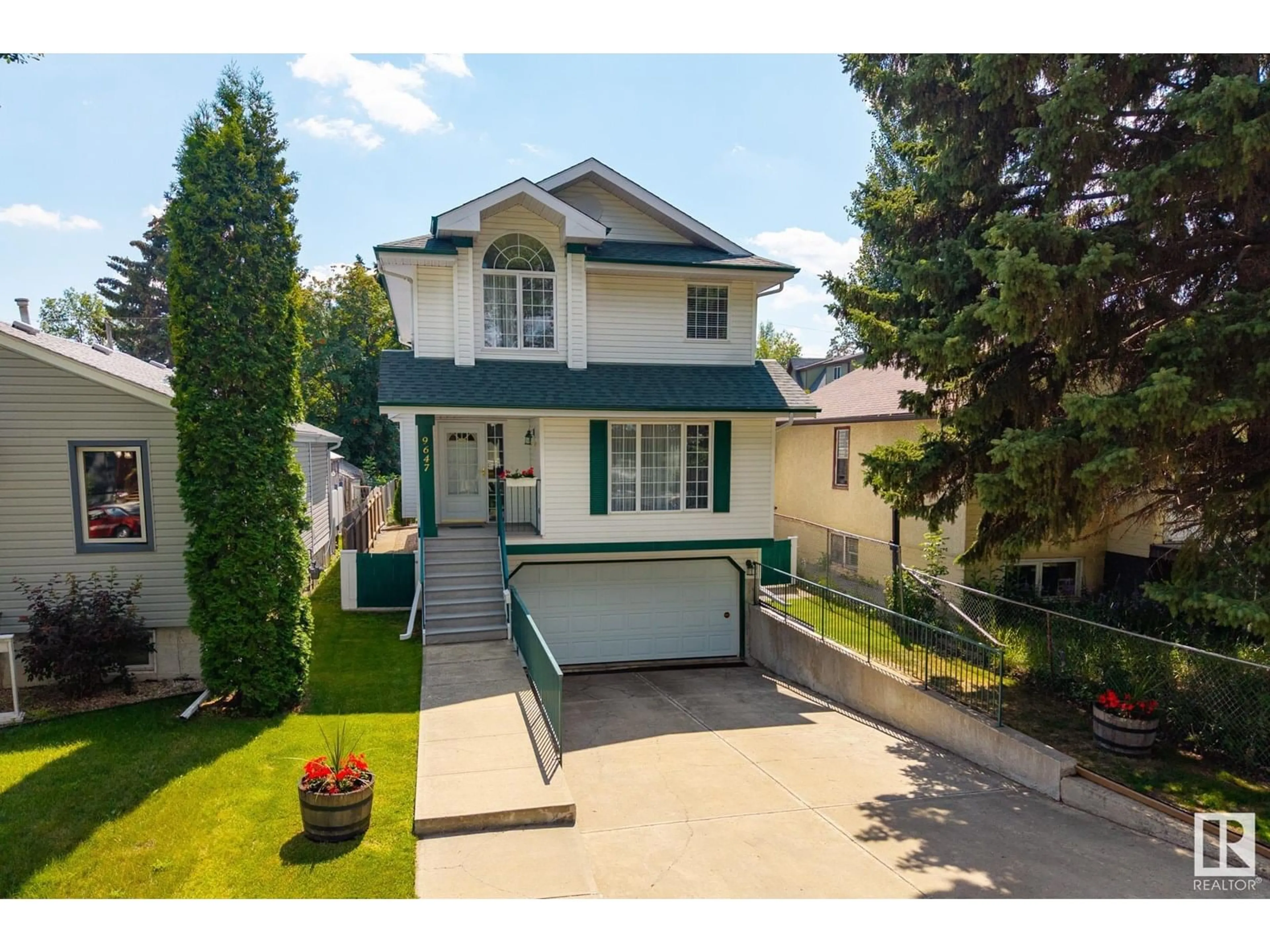 Home with vinyl exterior material, street for 9647 73 AV, Edmonton Alberta T6E1B3