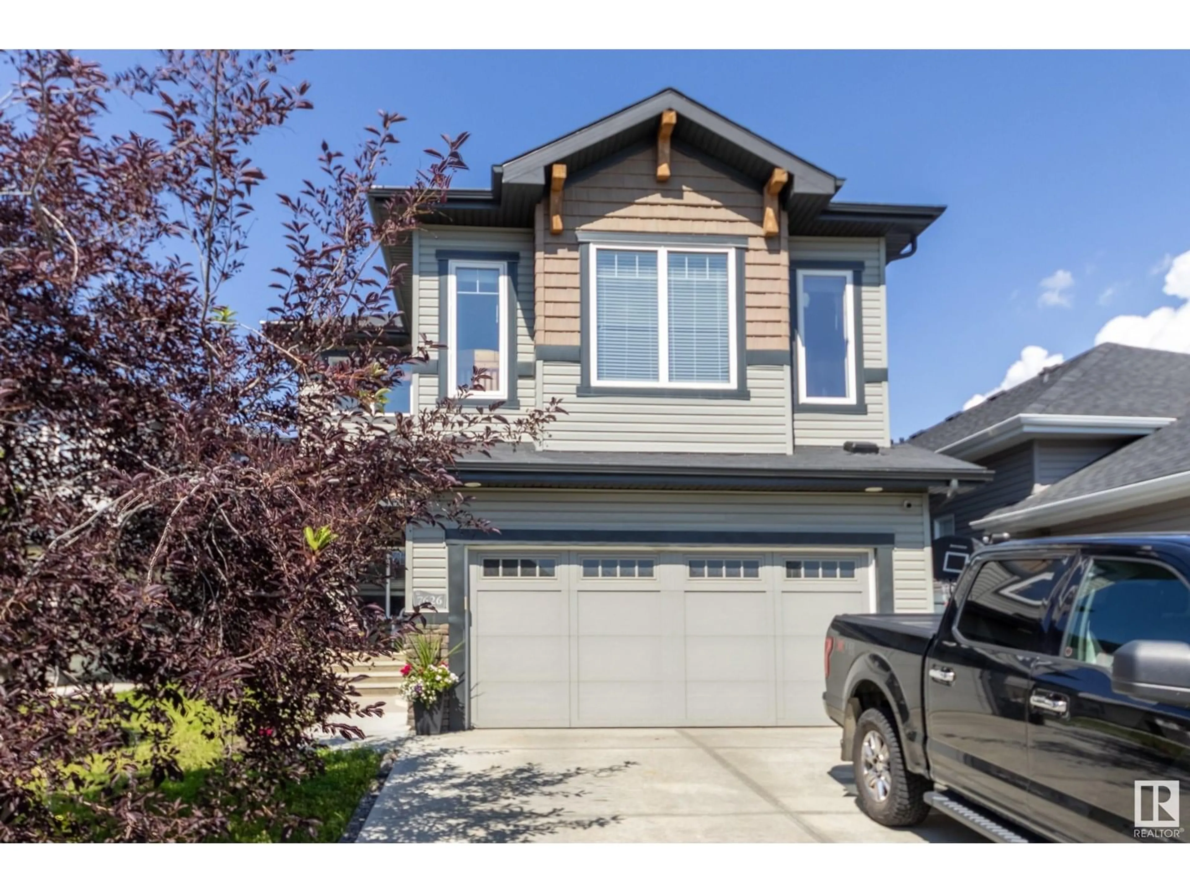 Home with vinyl exterior material, street for NW - 7626 GETTY LINK LI, Edmonton Alberta T5T4K9