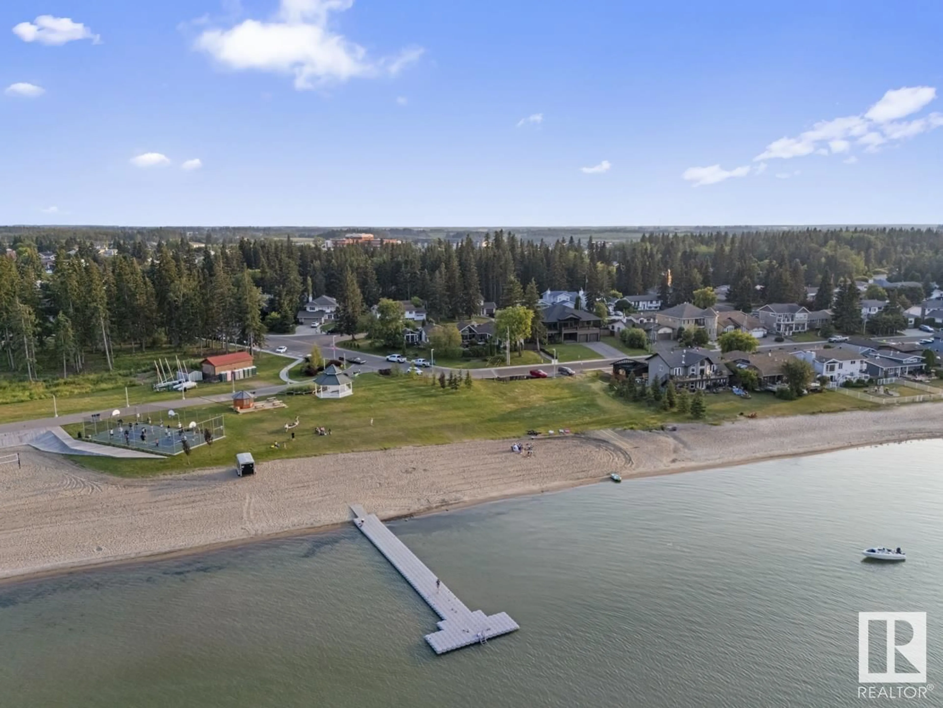 A pic from outside/outdoor area/front of a property/back of a property/a pic from drone, water/lake/river/ocean view for 203 PINE AV, Cold Lake Alberta T9M1E5