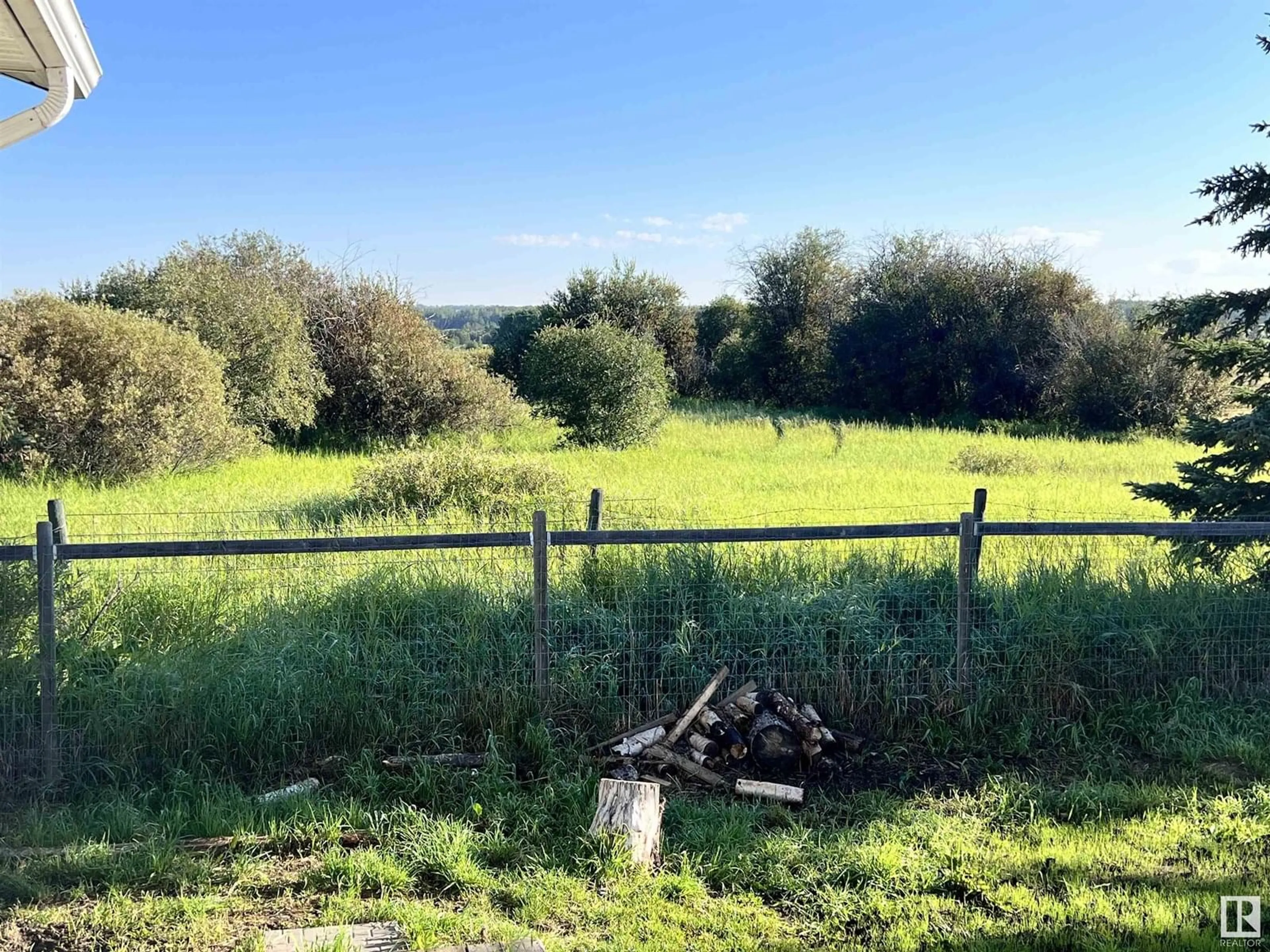 A pic from outside/outdoor area/front of a property/back of a property/a pic from drone, forest/trees view for 4806 50 AV, Rocky Rapids Alberta T0E1Z0