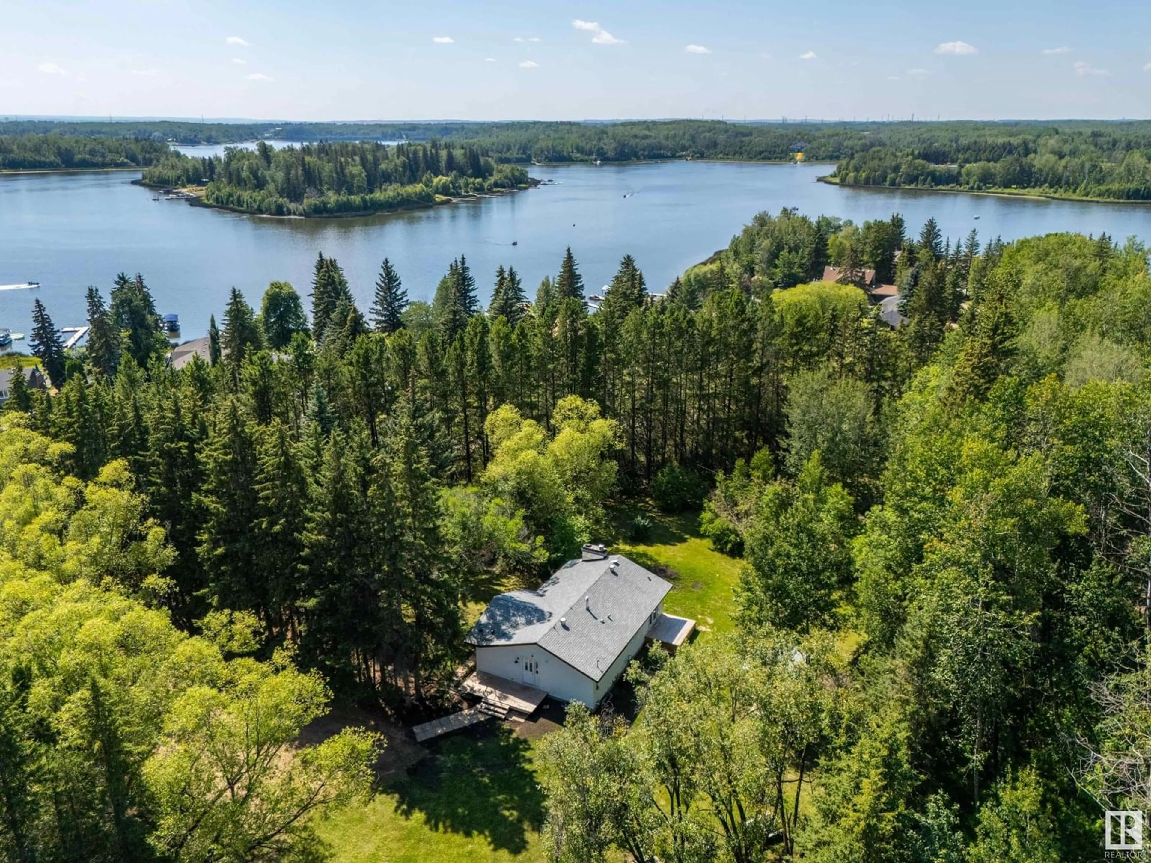 A pic from outside/outdoor area/front of a property/back of a property/a pic from drone, water/lake/river/ocean view for 60 2304 TWP ROAD 522, Rural Parkland County Alberta T0E0H0