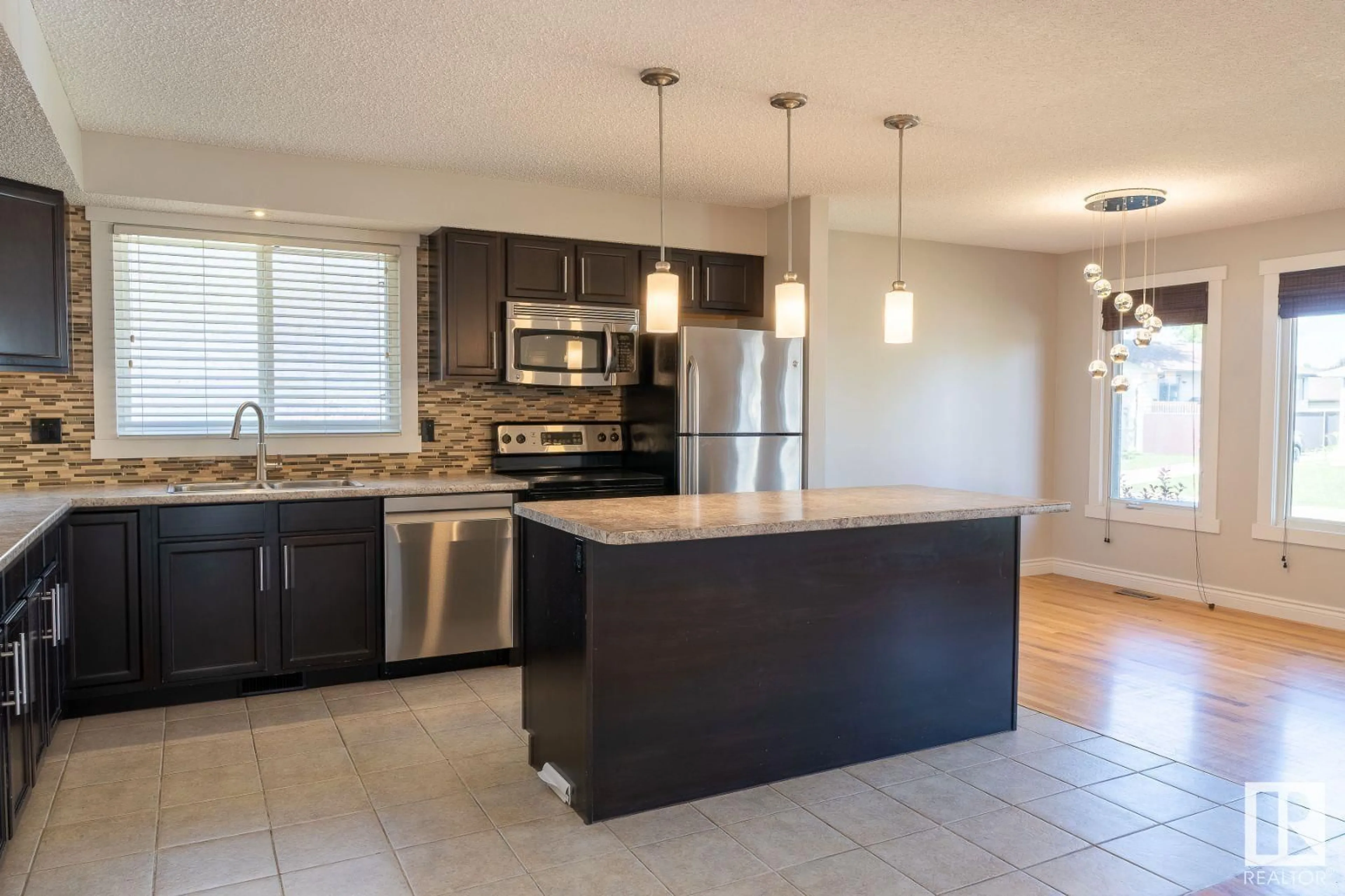 Open concept kitchen, ceramic/tile floor for 9216 82 ST, Fort Saskatchewan Alberta T8L3P2