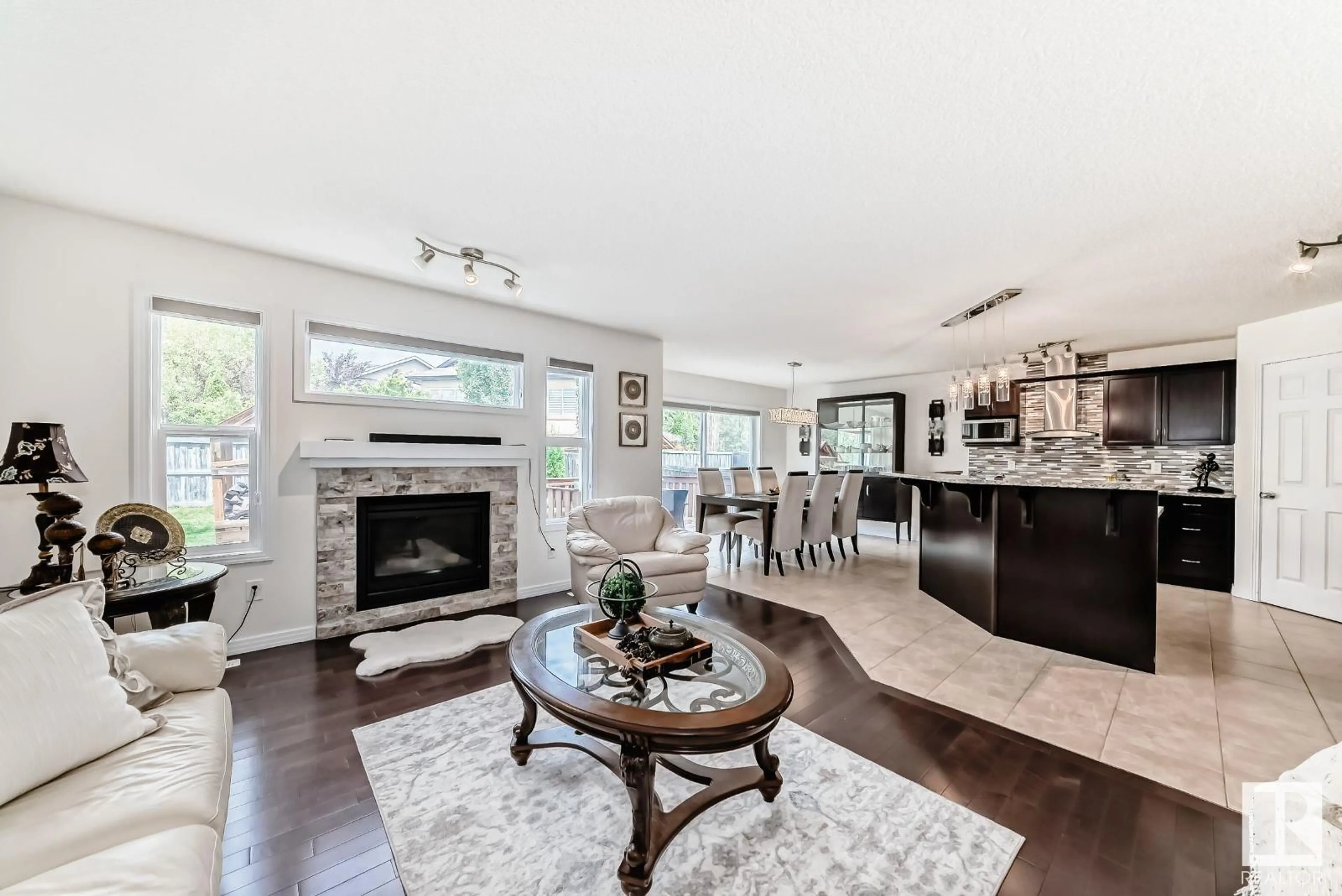 Open concept kitchen, wood/laminate floor for 6995 STROM LN, Edmonton Alberta T6R0P1