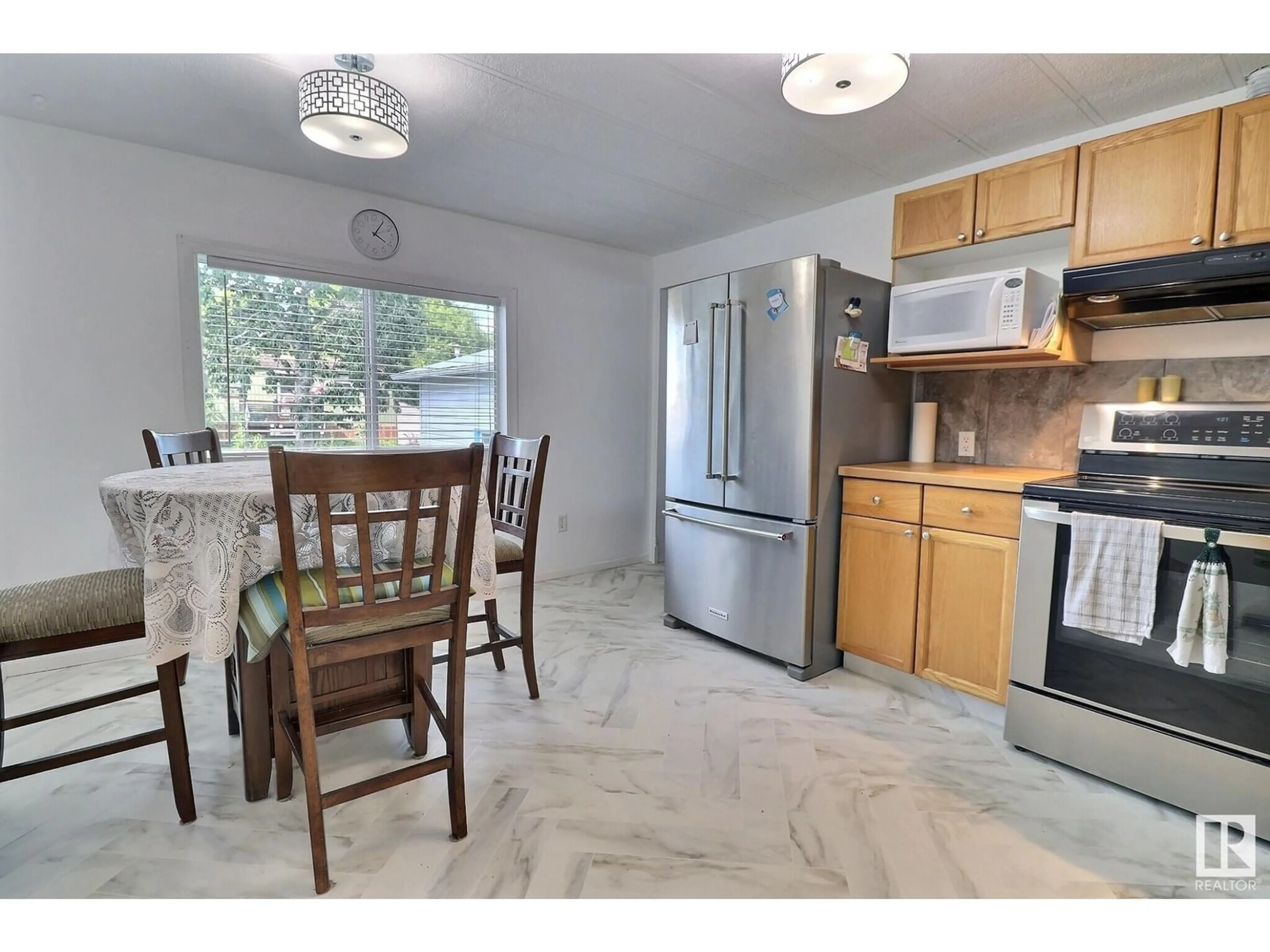 Open concept kitchen, ceramic/tile floor for 441 CEDAR AV, Edmonton Alberta T5Y4M2