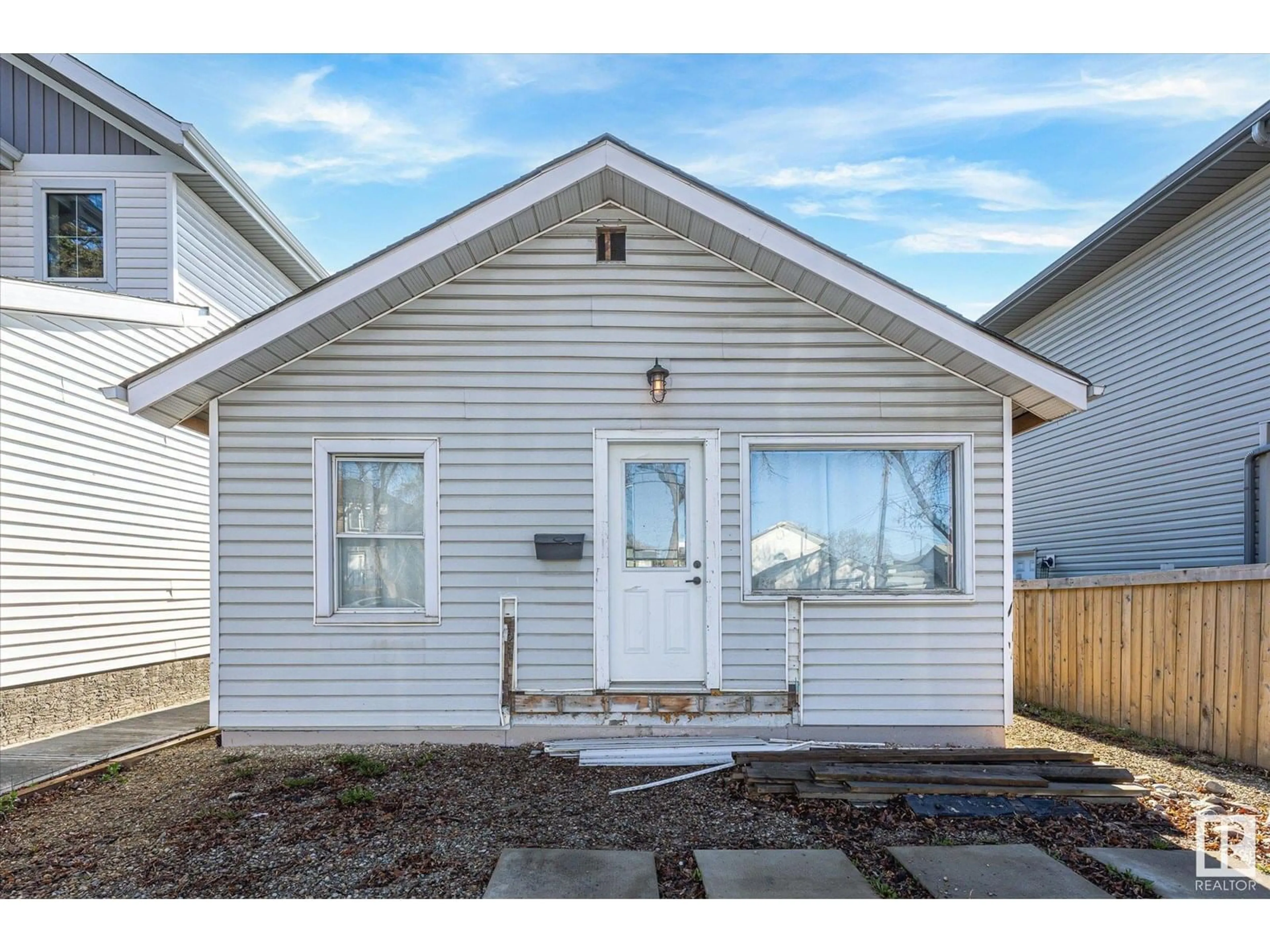 Home with vinyl exterior material, street for NW - 12717 116 ST, Edmonton Alberta T5E5H1