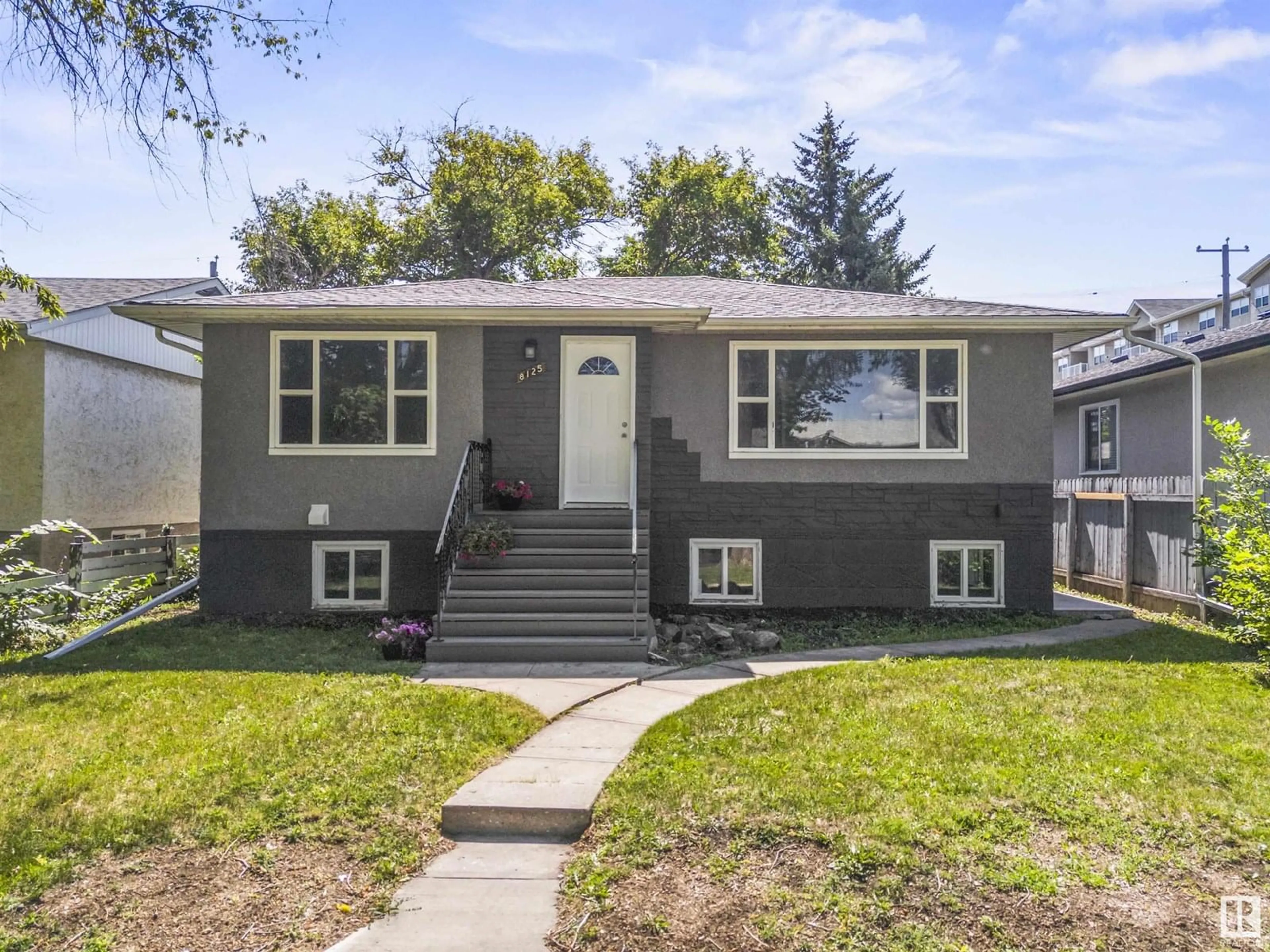 Home with vinyl exterior material, street for 8125 84 AV, Edmonton Alberta T6C1C7
