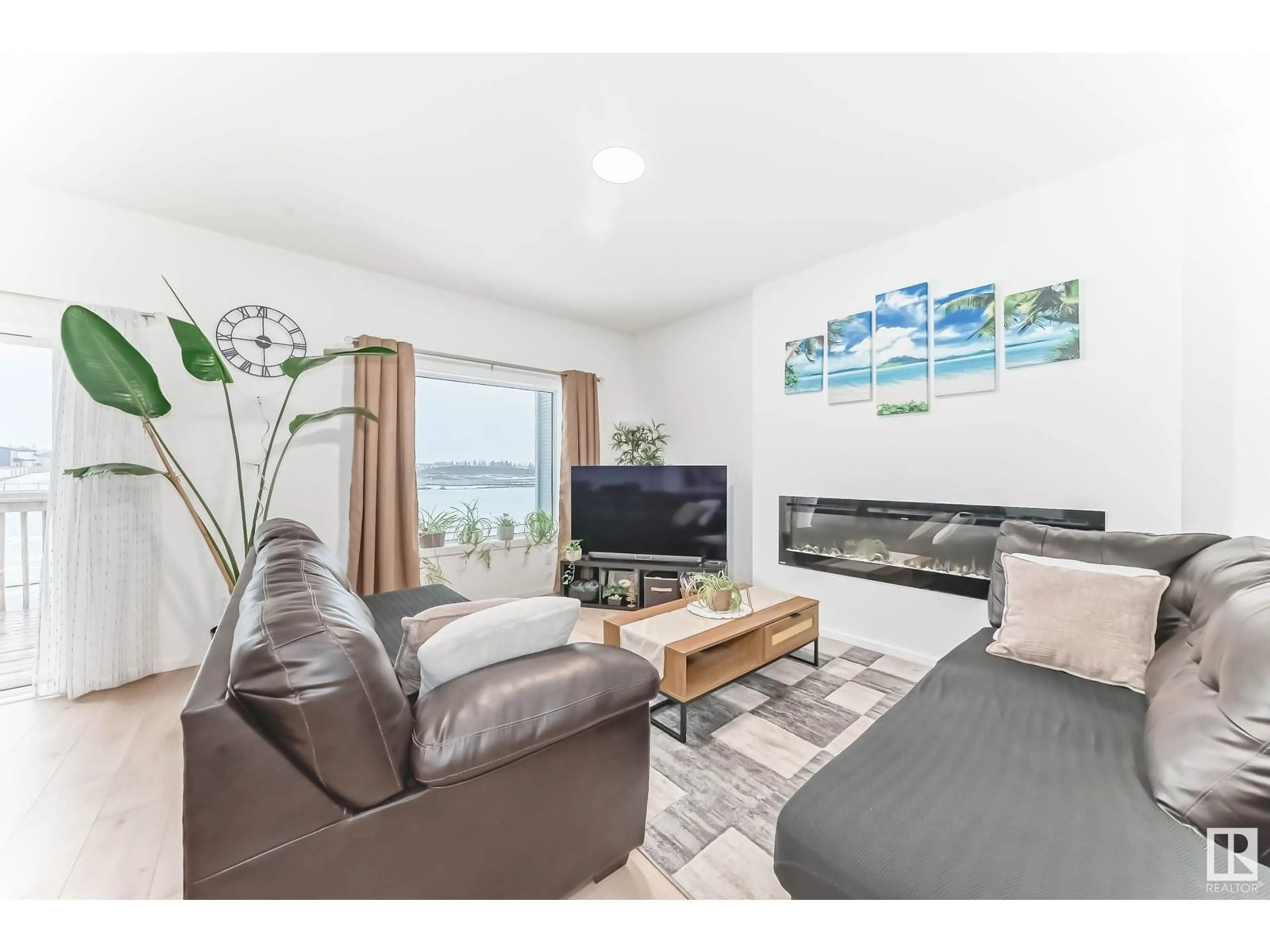 Living room with furniture, wood/laminate floor for 4595 66 ST, Beaumont Alberta T4X2Z4