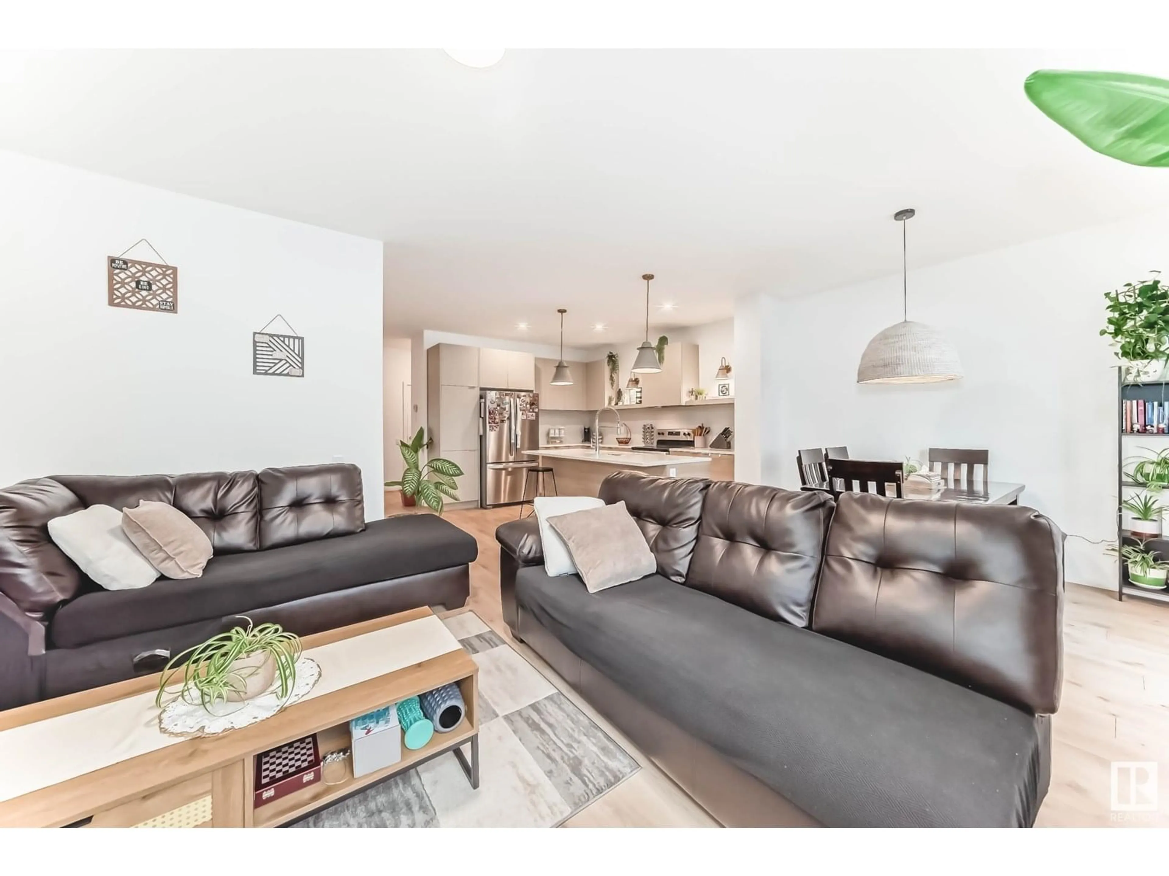 Living room with furniture, wood/laminate floor for 4595 66 ST, Beaumont Alberta T4X2Z4