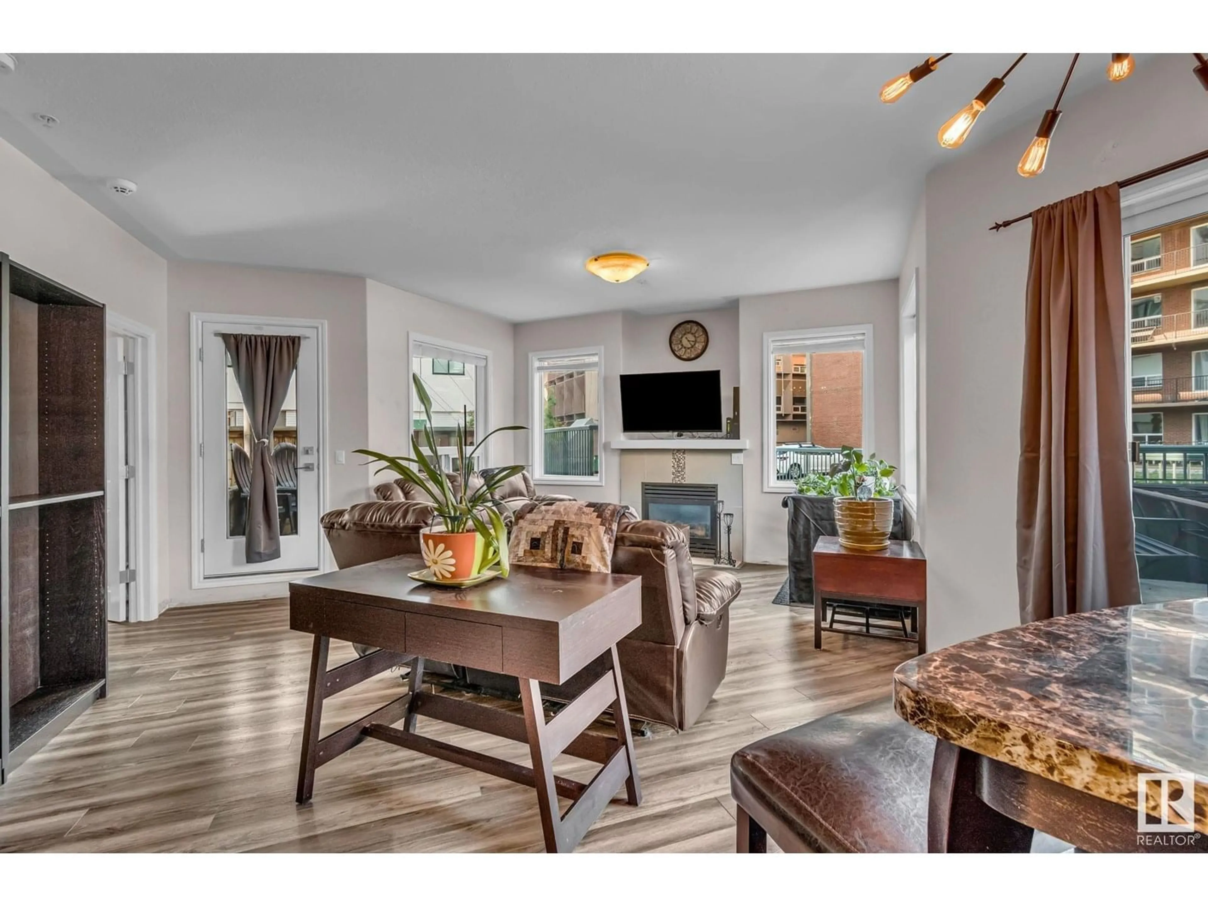 Open concept kitchen, wood/laminate floor for #104 - 10046 110 ST NW, Edmonton Alberta T5K2Y2