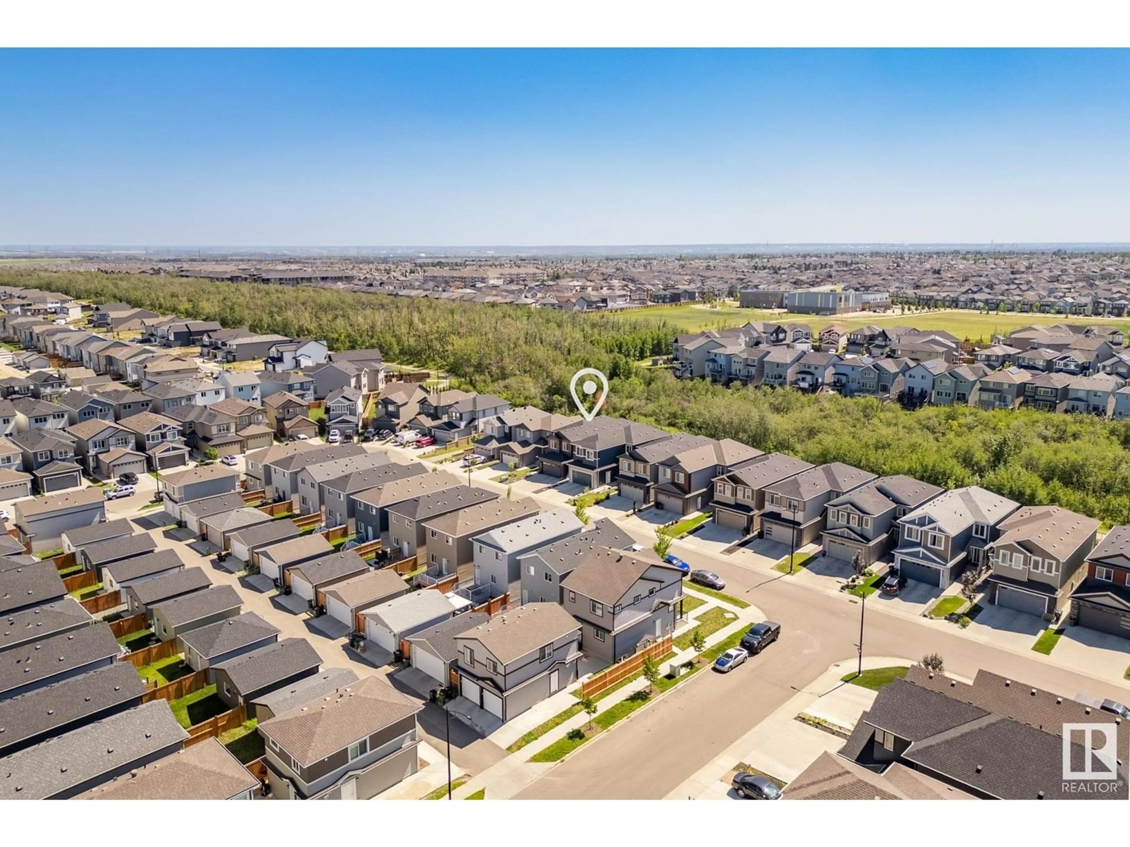A pic from outside/outdoor area/front of a property/back of a property/a pic from drone, unknown for 6419 175 AV NW, Edmonton Alberta T5Y4A8