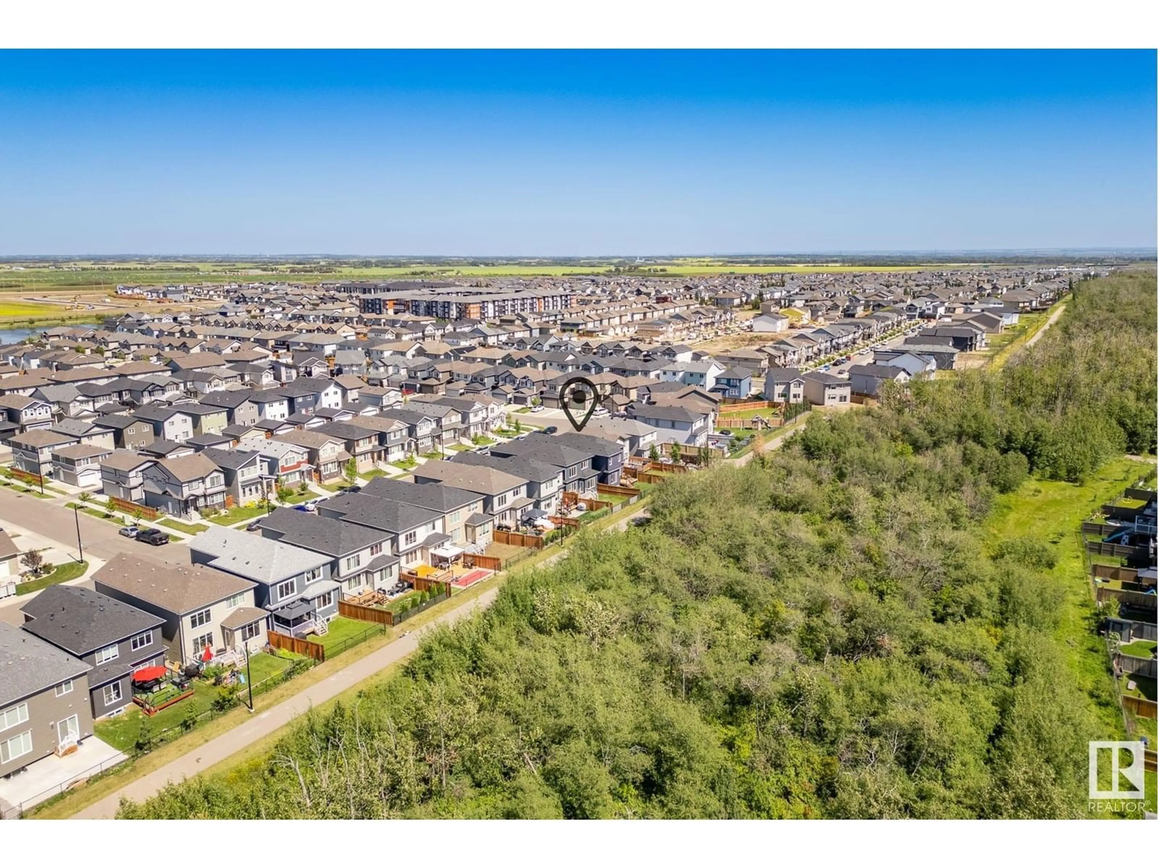 A pic from outside/outdoor area/front of a property/back of a property/a pic from drone, unknown for 6419 175 AV NW, Edmonton Alberta T5Y4A8