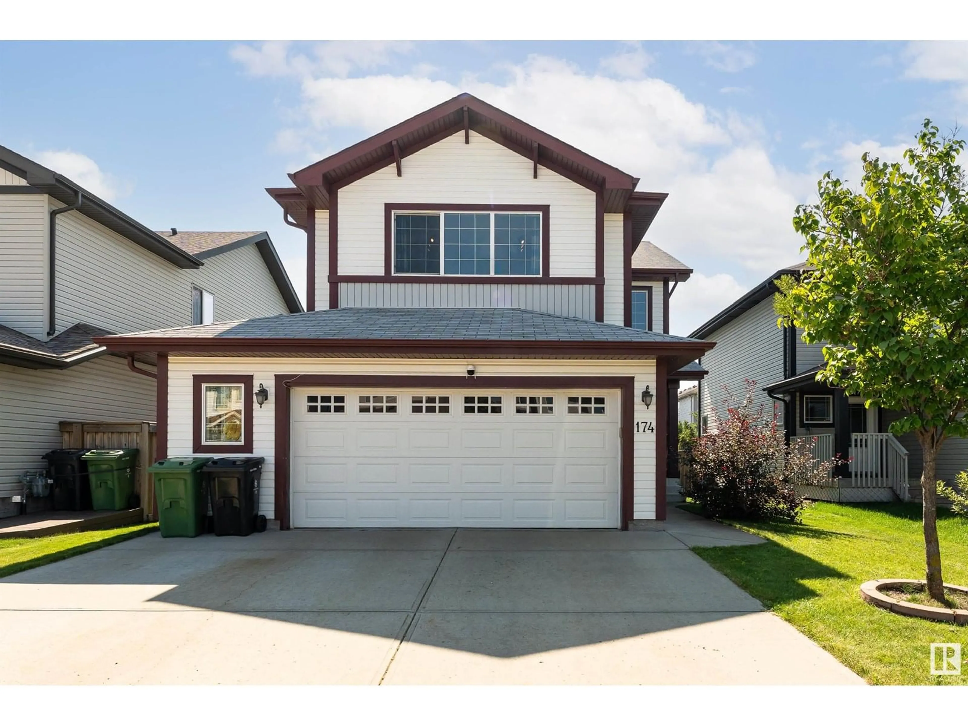 Home with vinyl exterior material, street for 174 WOODBEND WY, Fort Saskatchewan Alberta T8L4S4