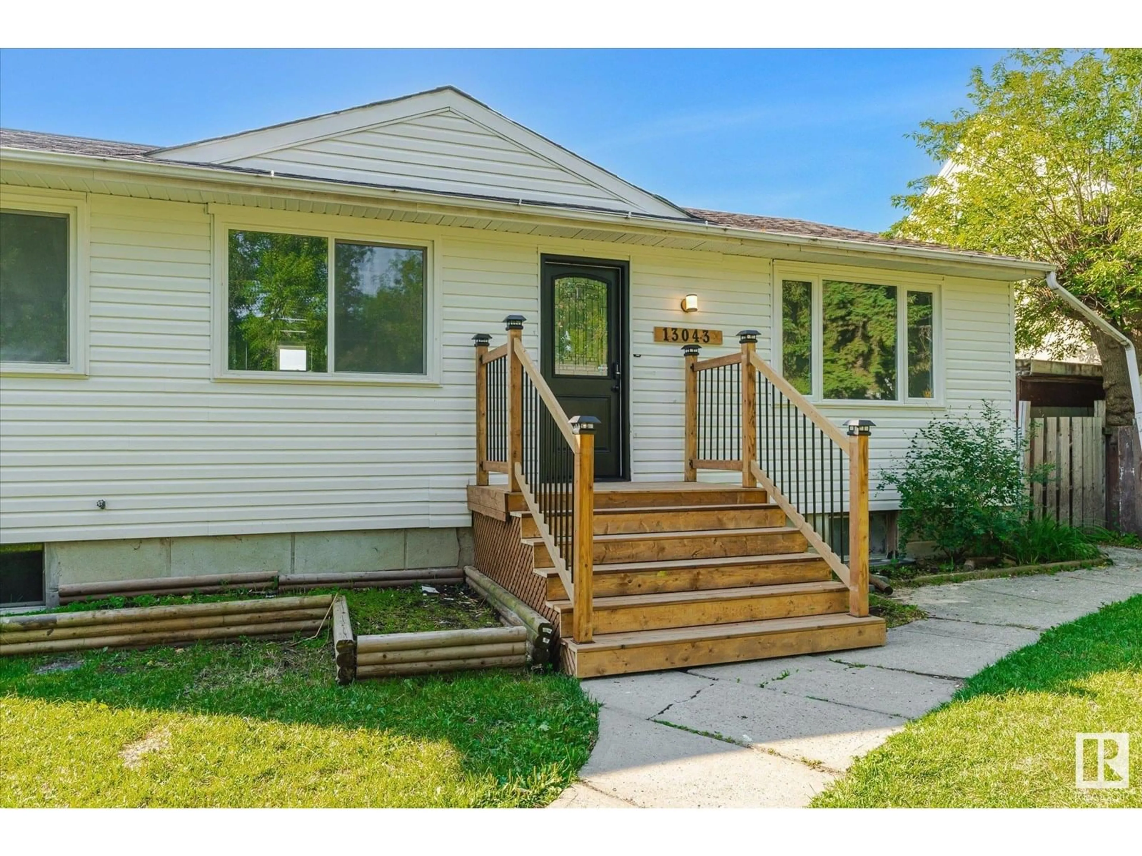 Home with vinyl exterior material, street for 13043 SHERBROOKE AV, Edmonton Alberta T5L4E6