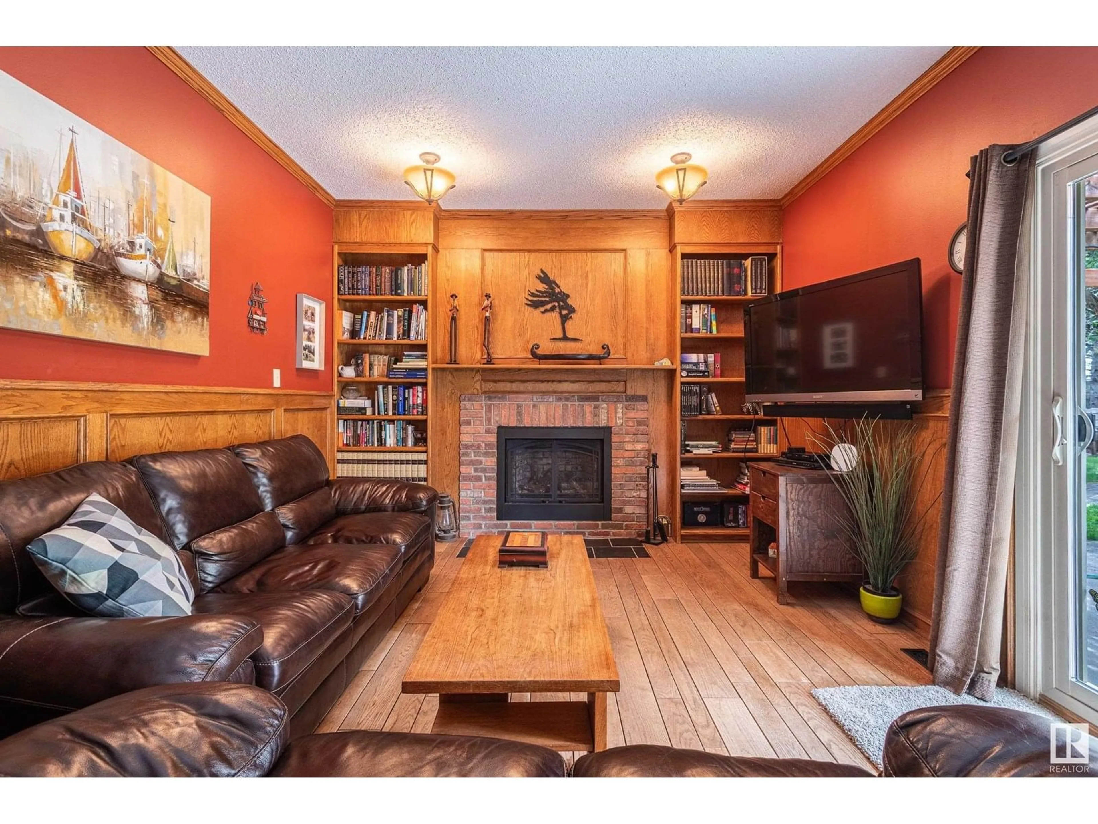 Living room with furniture, wood/laminate floor for 11103 21 AV, Edmonton Alberta T6J5C7