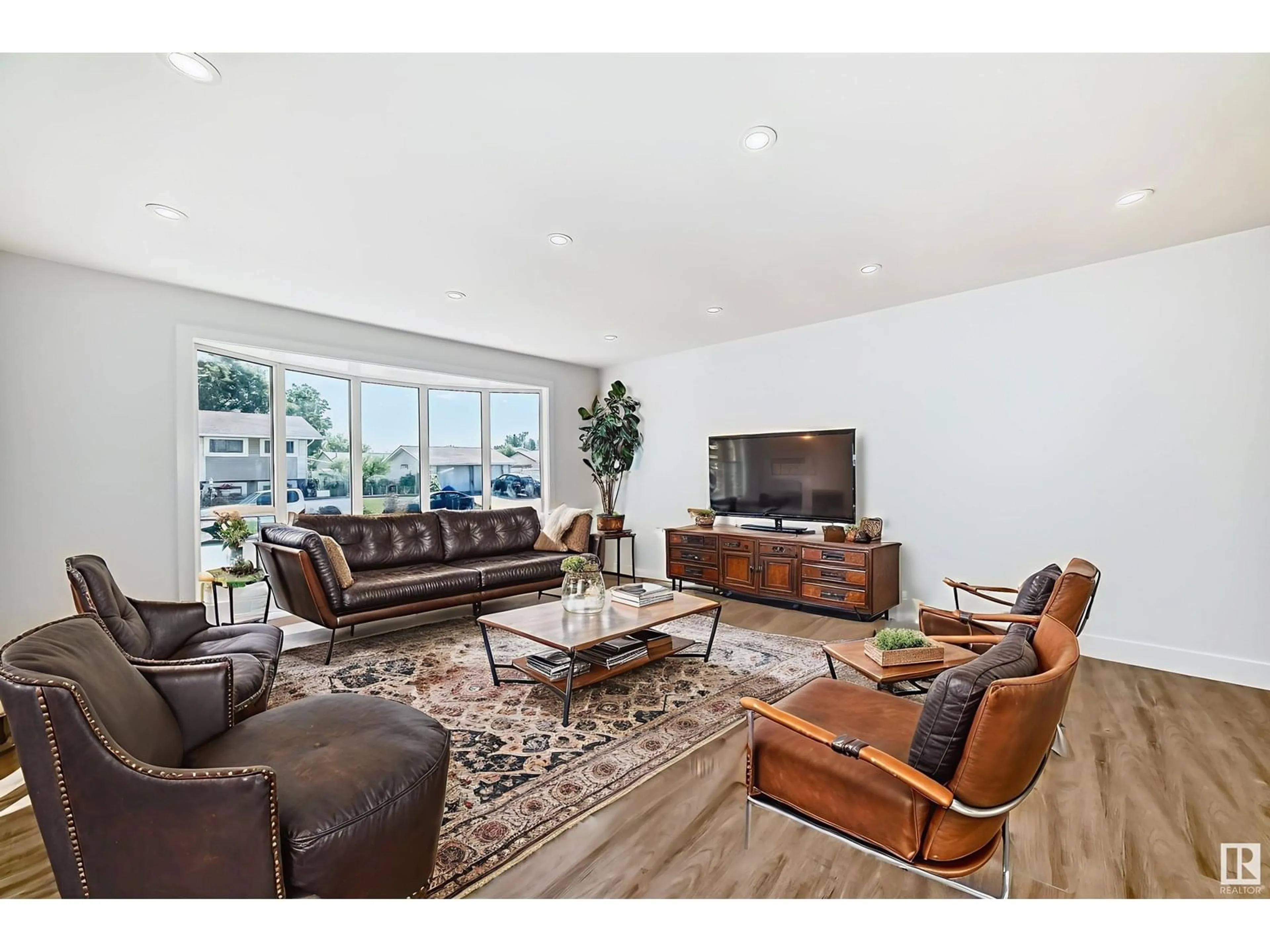 Living room with furniture, wood/laminate floor for NW - 15016 88 ST, Edmonton Alberta T5E5T5