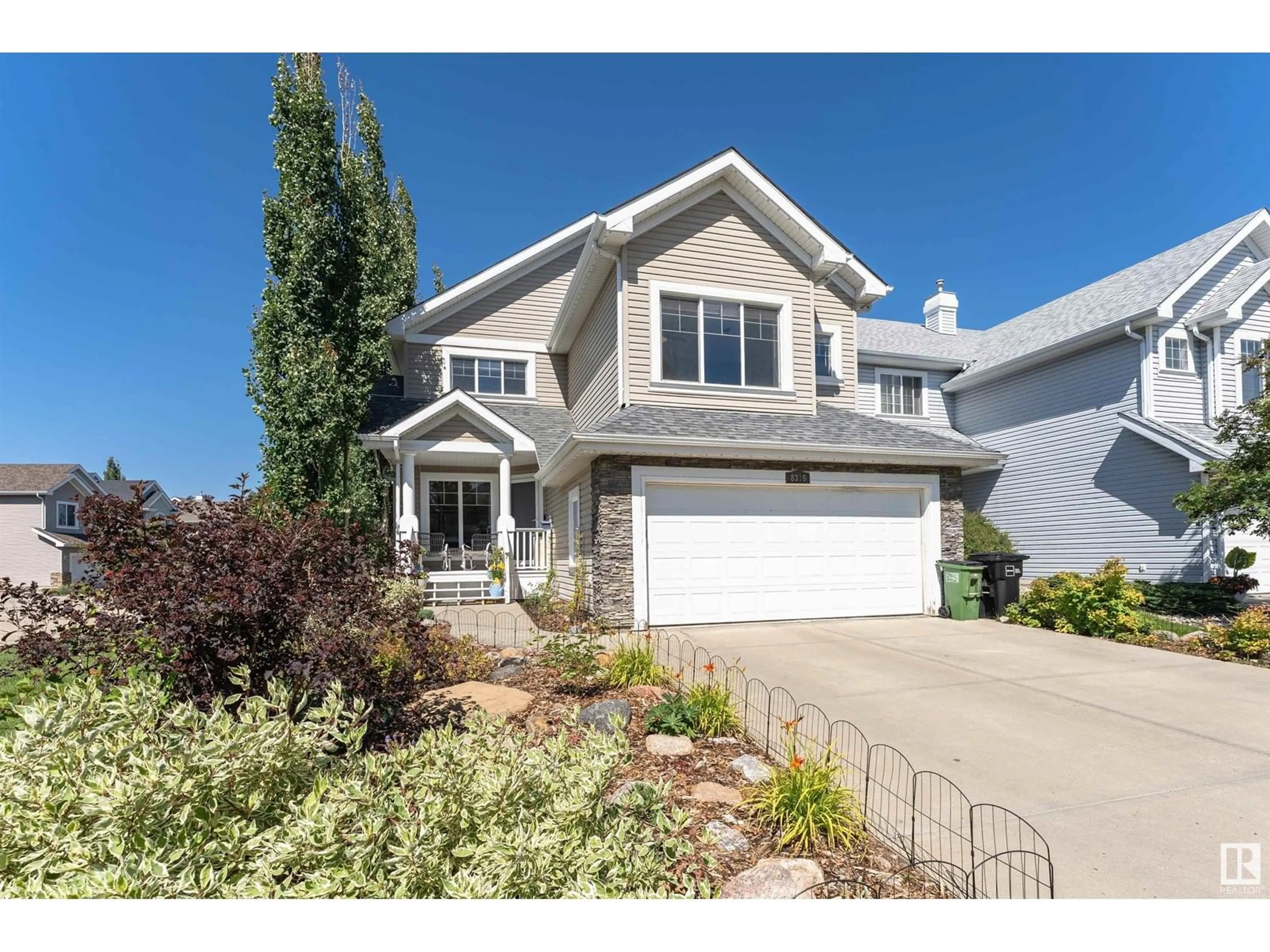 Home with vinyl exterior material, street for SW - 8316 12 AV, Edmonton Alberta T6X1E3