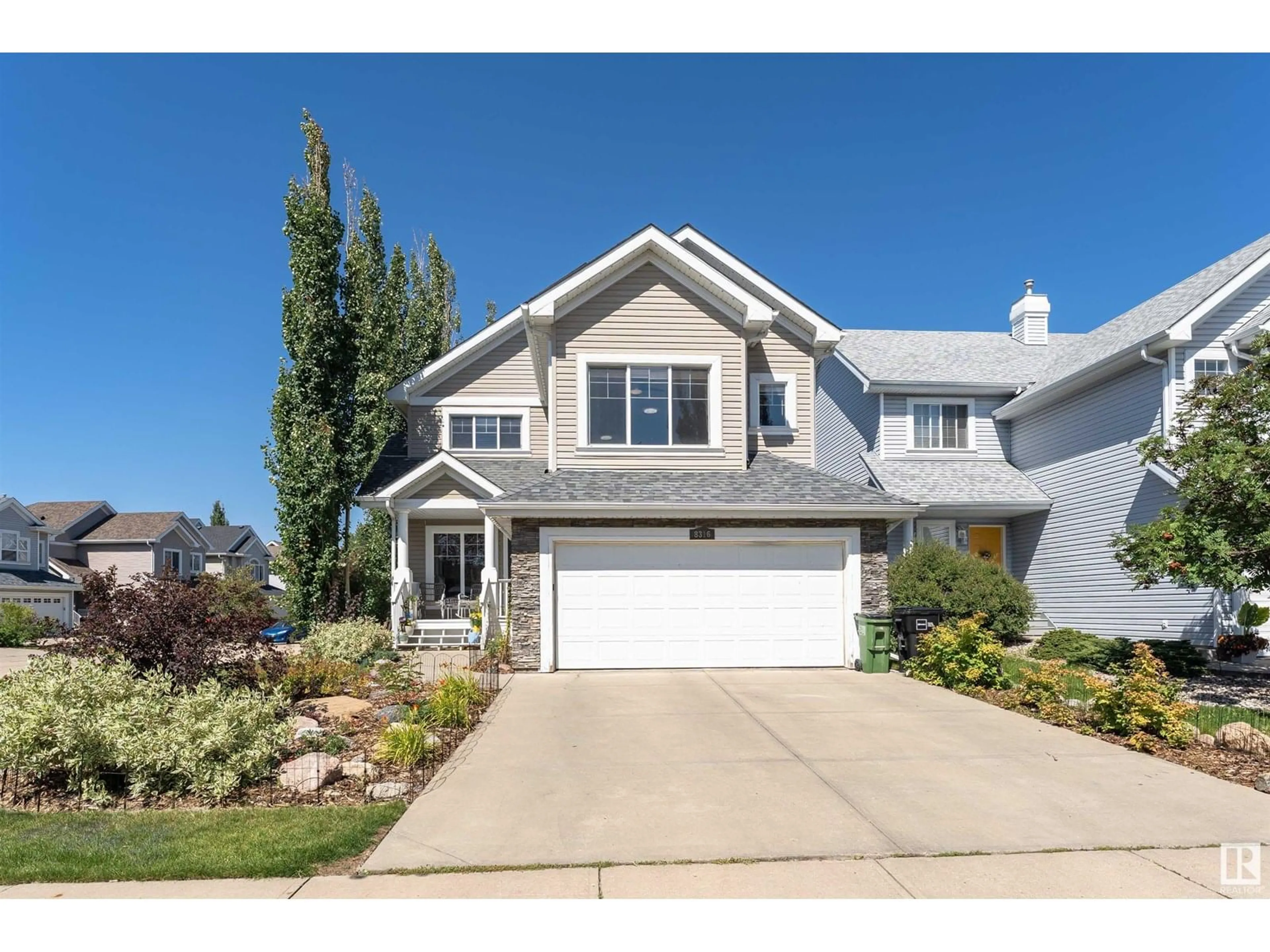 Home with vinyl exterior material, street for SW - 8316 12 AV, Edmonton Alberta T6X1E3