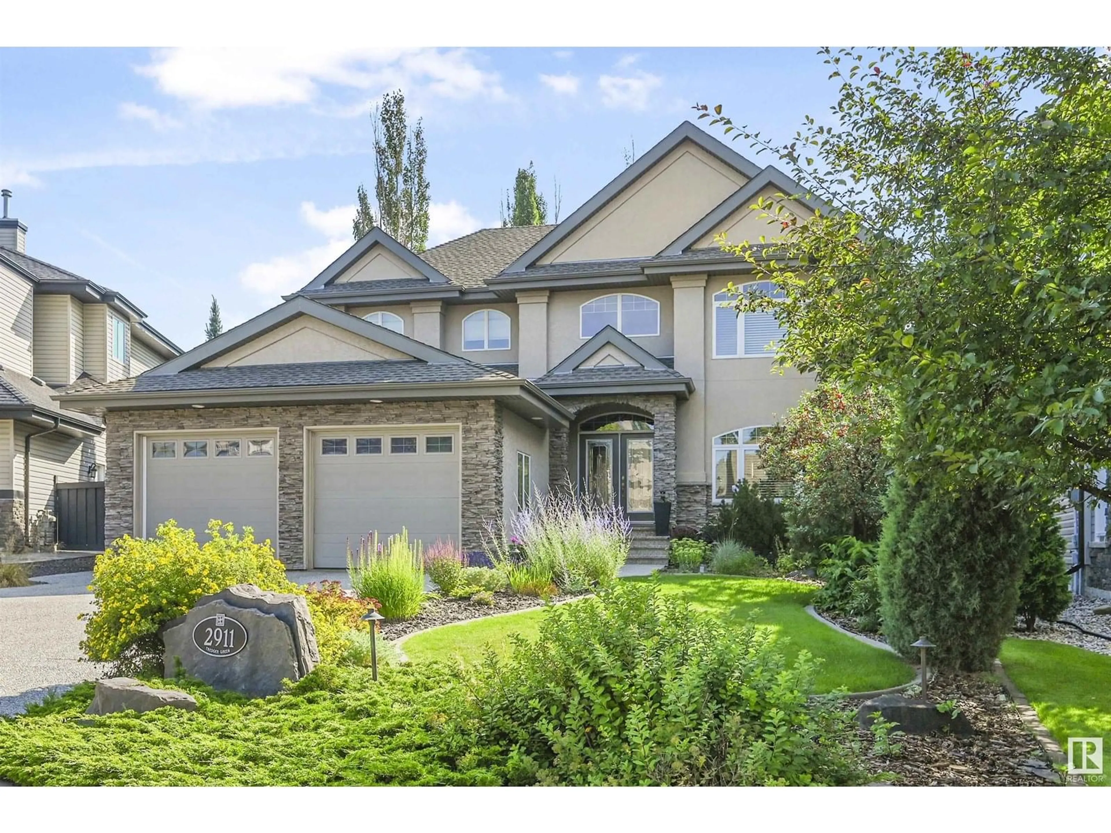 Home with vinyl exterior material, street for 2911 TREDGER GR, Edmonton Alberta T6R3R7