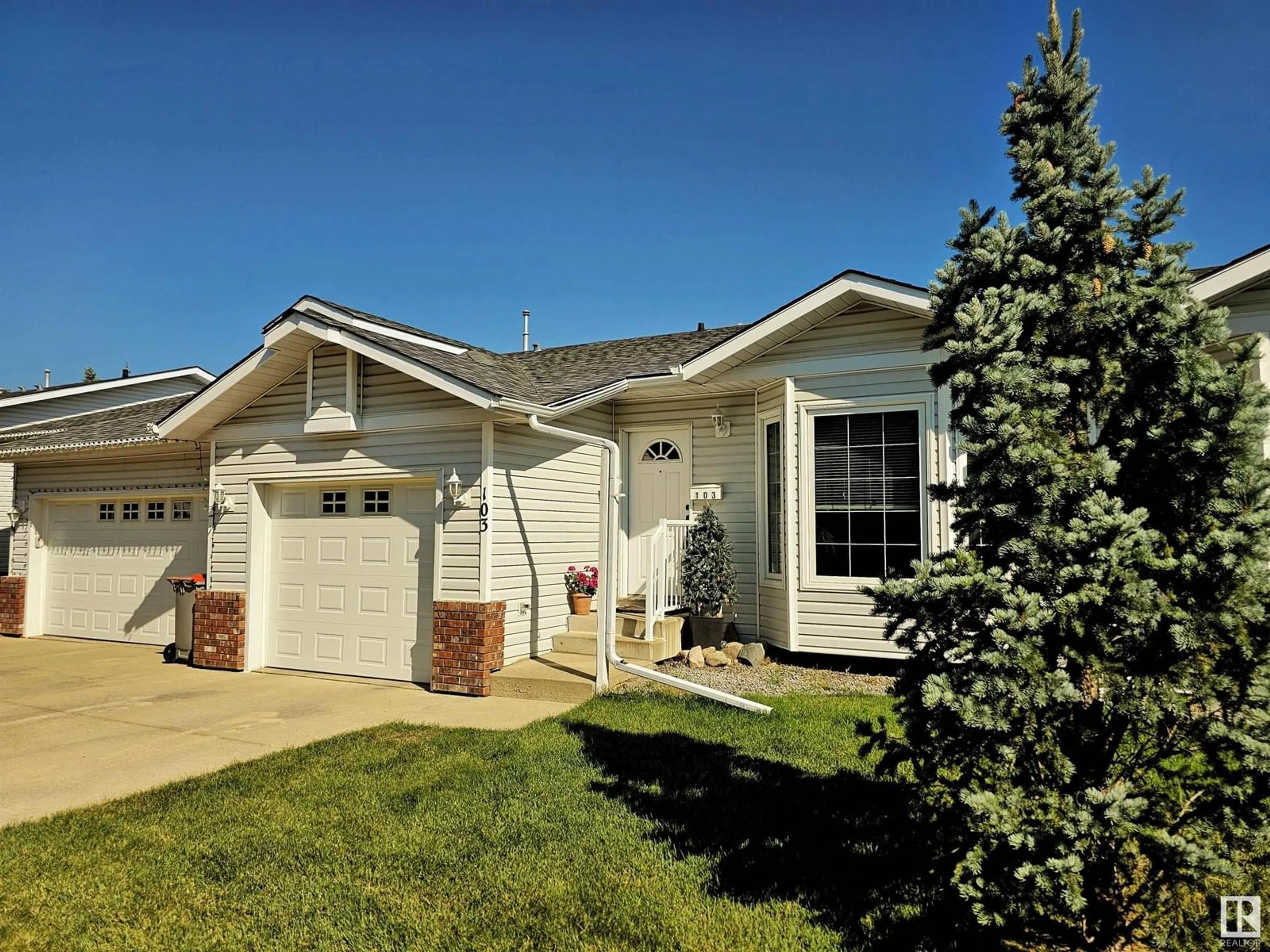 Home with vinyl exterior material, street for #103 - 4408 37 ST, Stony Plain Alberta T7Z1N2