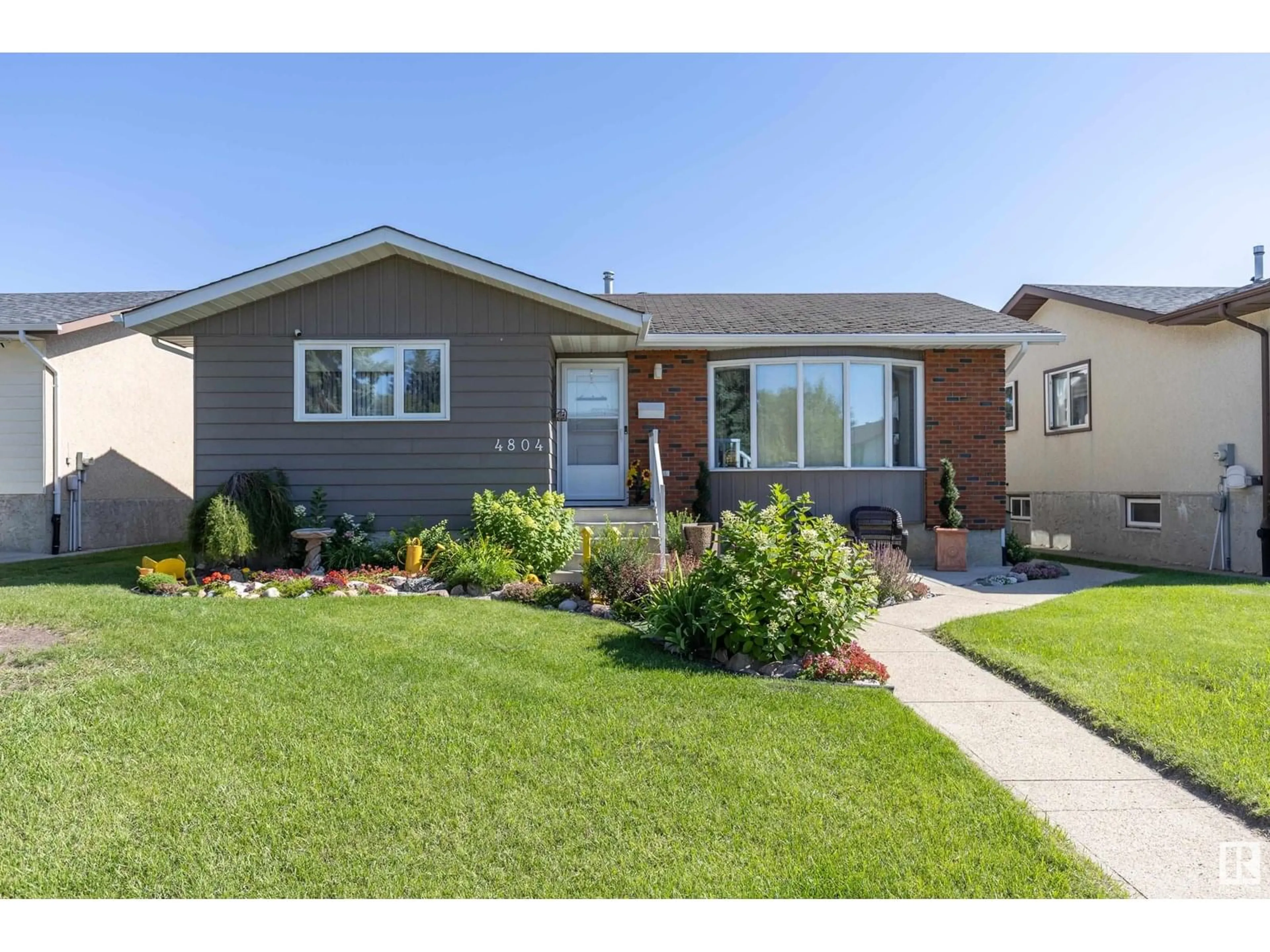 Home with vinyl exterior material, street for 4804 11A AV, Edmonton Alberta T6L4A8