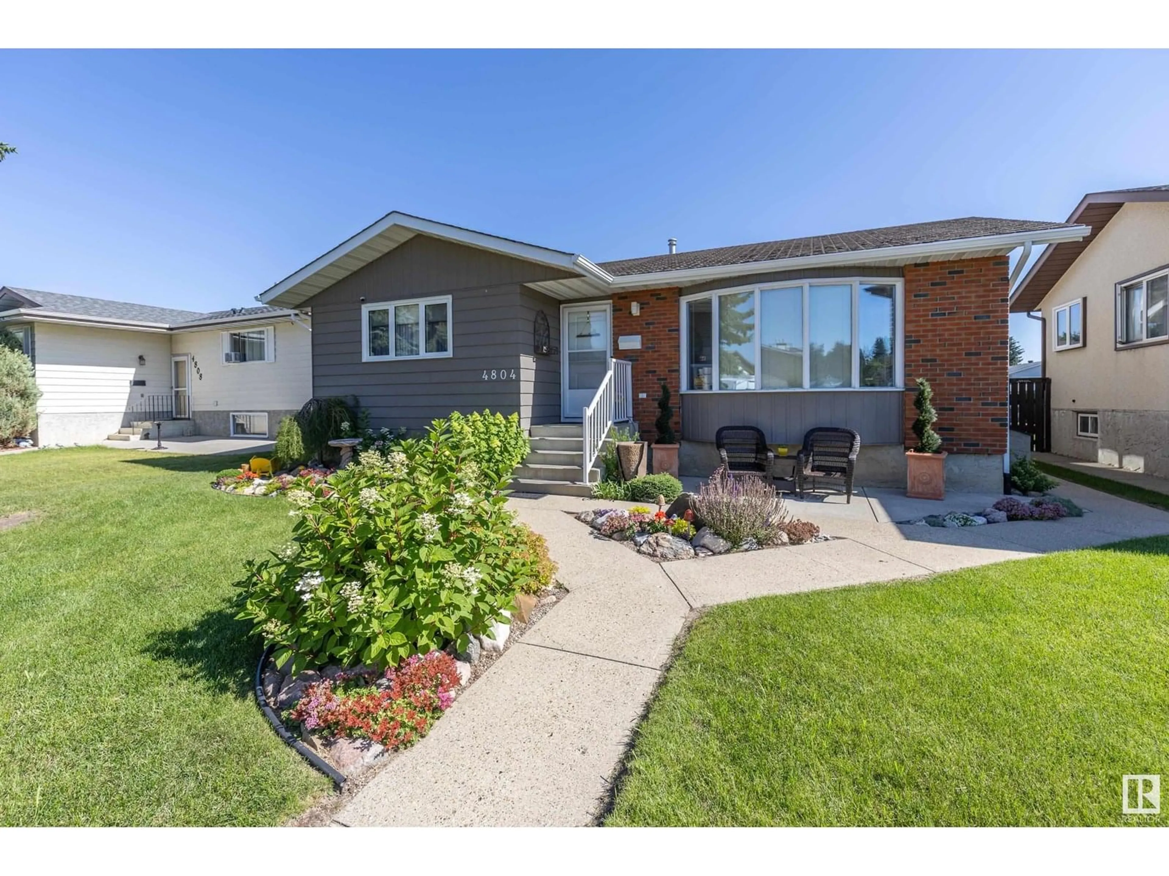 Home with vinyl exterior material, street for 4804 11A AV, Edmonton Alberta T6L4A8