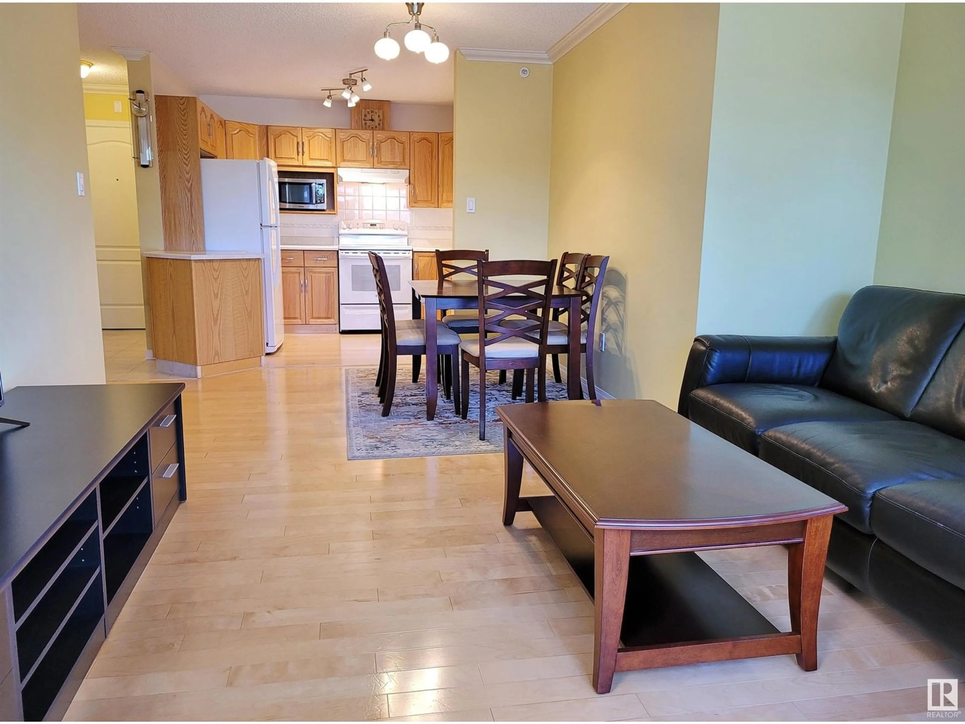 Living room with furniture, wood/laminate floor for 404 - 13450 114 AV, Edmonton Alberta T5M4C4