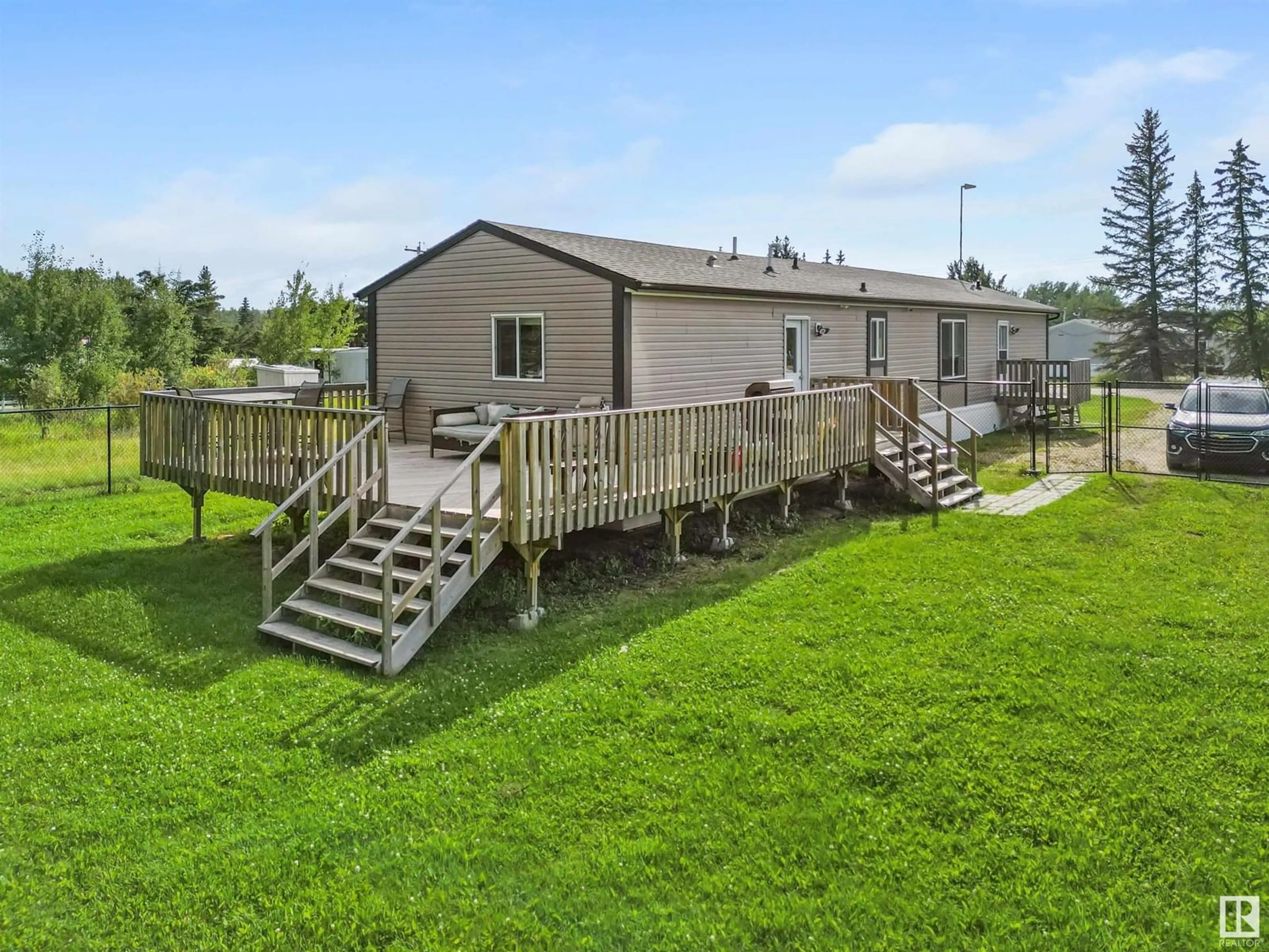 A pic from outside/outdoor area/front of a property/back of a property/a pic from drone, water/lake/river/ocean view for 4725 50 STREET, Violet Grove Alberta T7A1J5