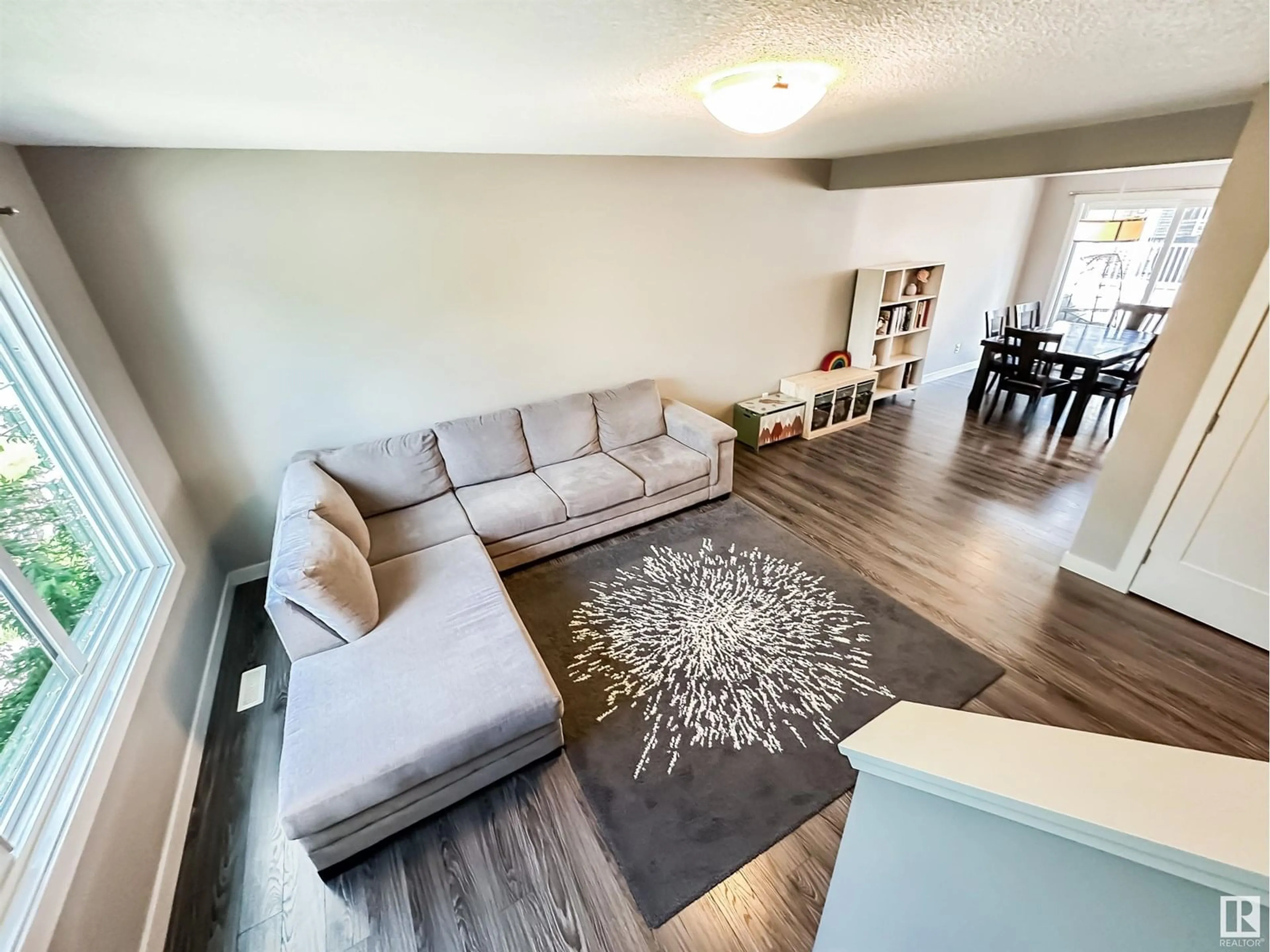 Living room with furniture, wood/laminate floor for 4217 30 ST, Edmonton Alberta T6T2G9
