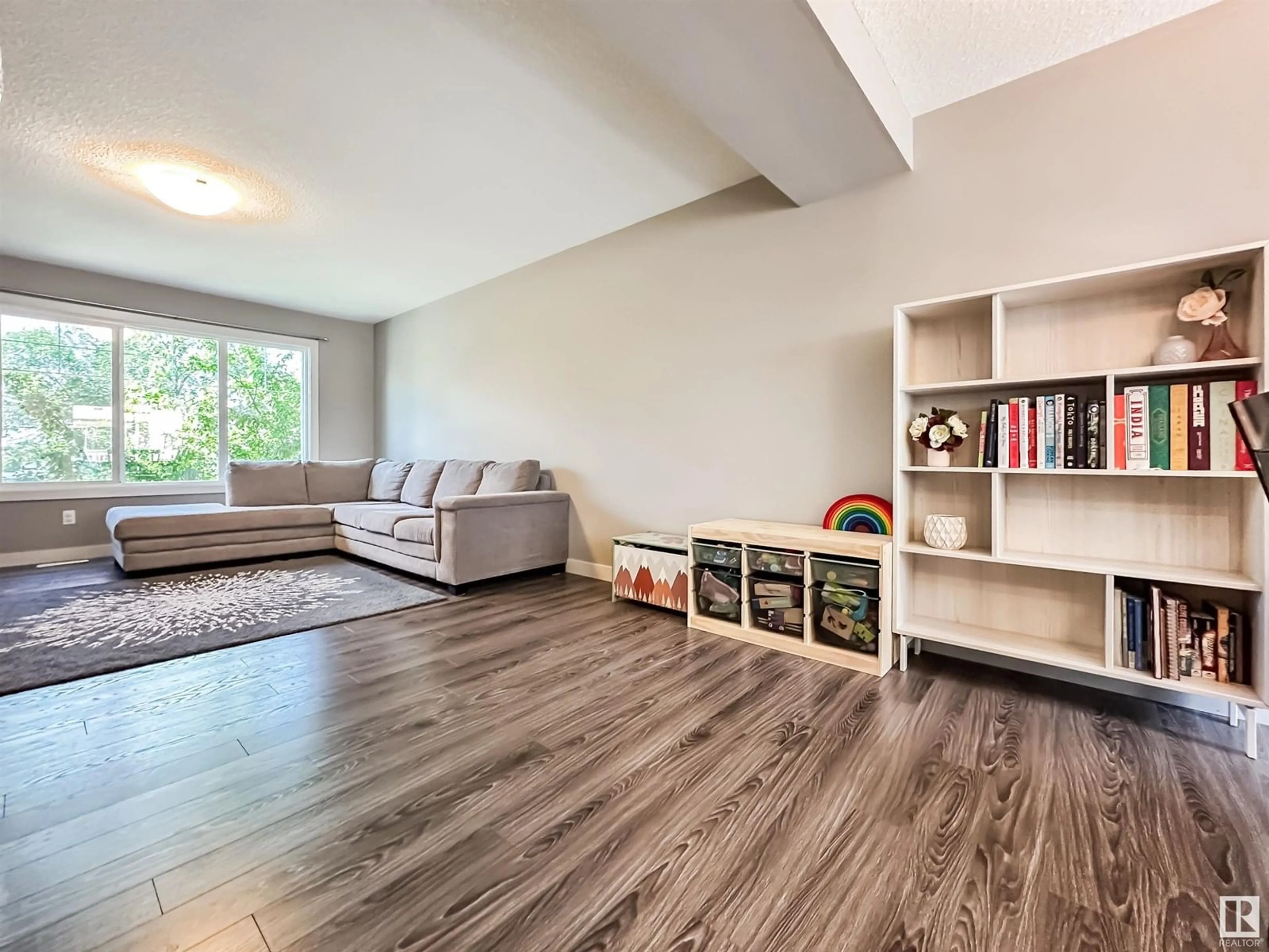Living room with furniture, wood/laminate floor for 4217 30 ST, Edmonton Alberta T6T2G9