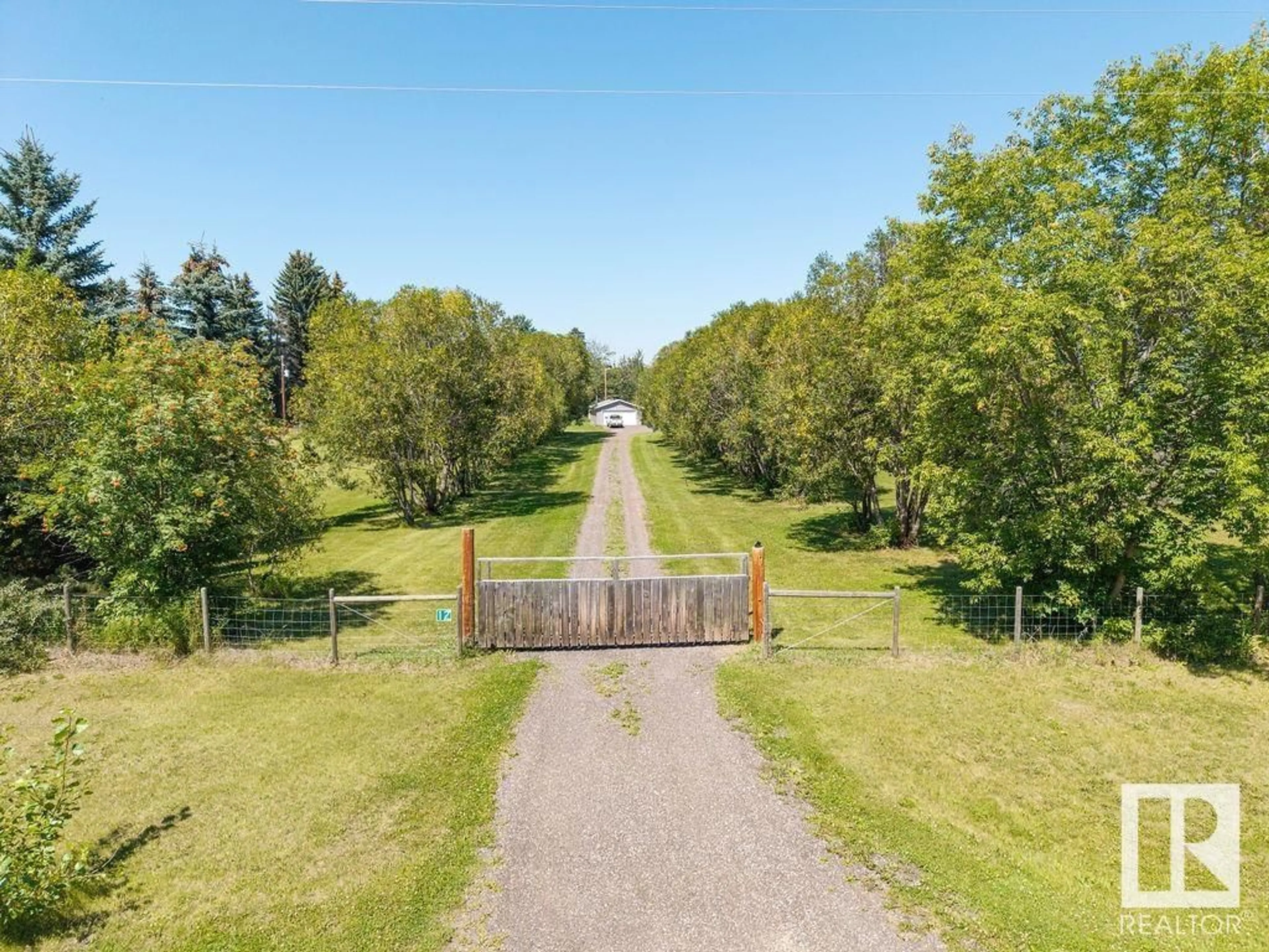 A pic from outside/outdoor area/front of a property/back of a property/a pic from drone, forest/trees view for 51526 - 12 RGE ROAD 273, Rural Parkland County Alberta T7Y1H7