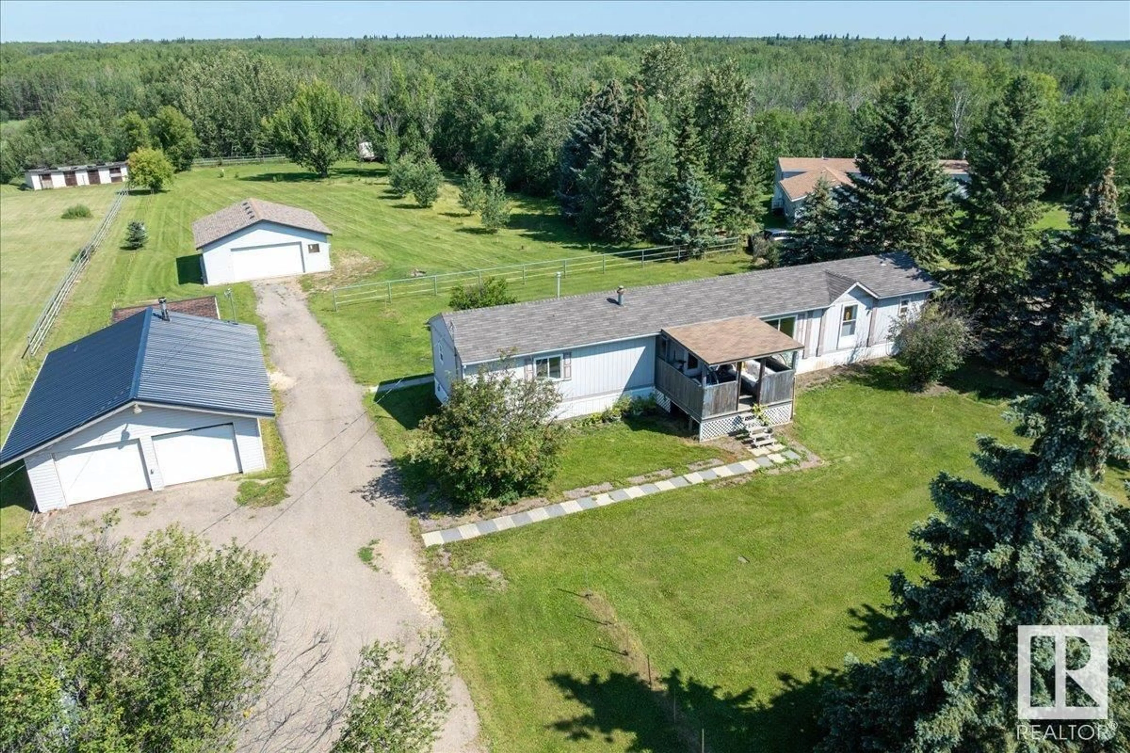 A pic from outside/outdoor area/front of a property/back of a property/a pic from drone, unknown for #106 - 49427 RANGE ROAD 211 A, Rural Camrose County Alberta T4V1N1