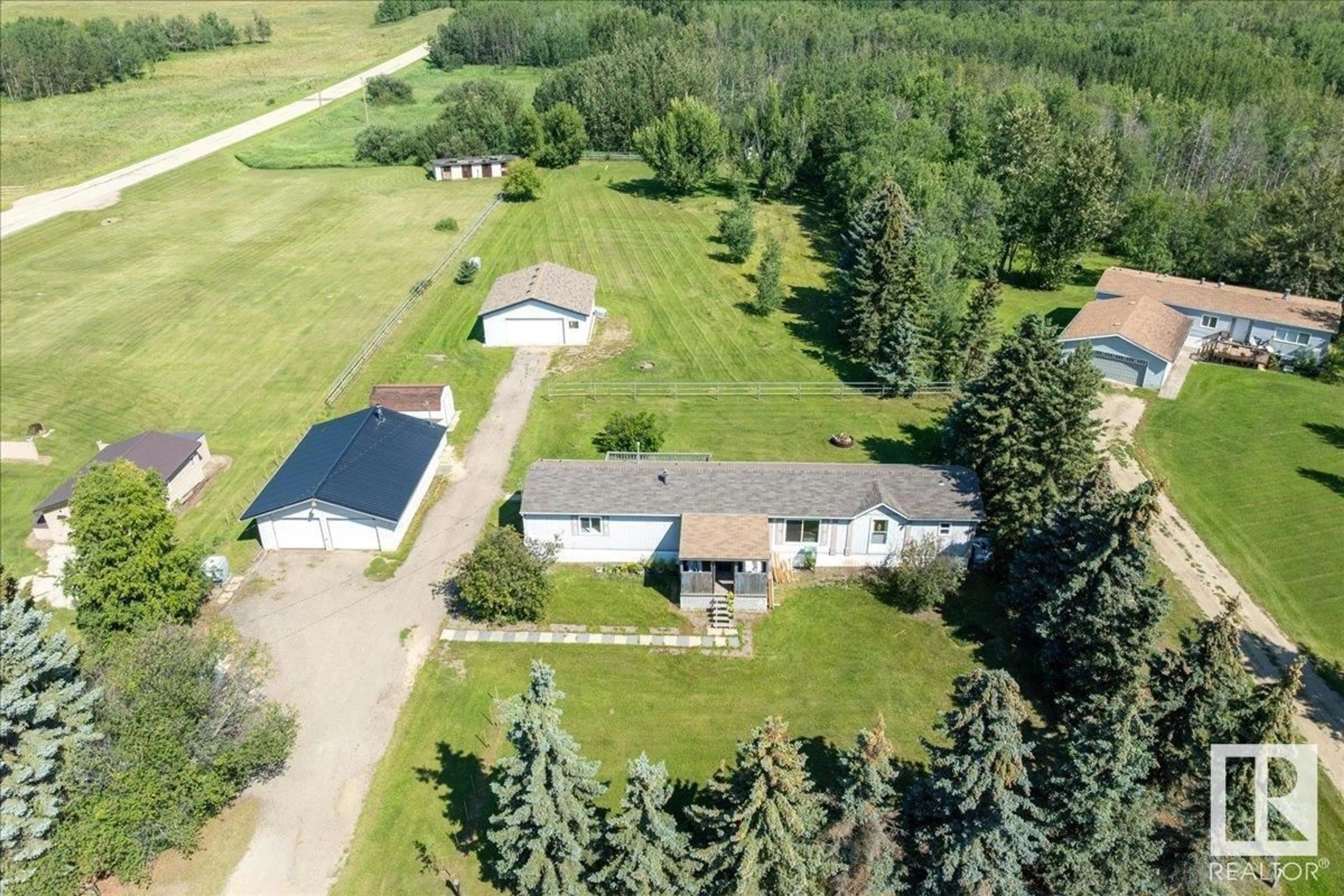 A pic from outside/outdoor area/front of a property/back of a property/a pic from drone, unknown for #106 - 49427 RANGE ROAD 211 A, Rural Camrose County Alberta T4V1N1