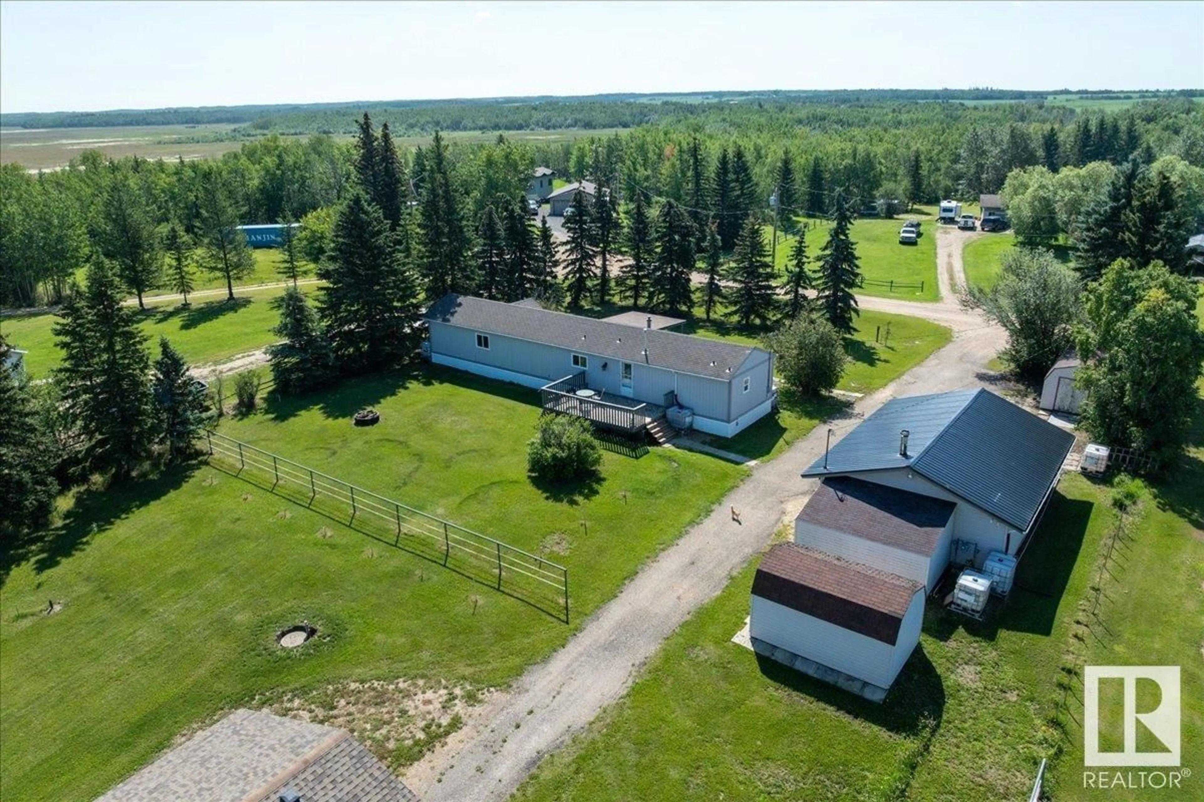 A pic from outside/outdoor area/front of a property/back of a property/a pic from drone, unknown for #106 - 49427 RANGE ROAD 211 A, Rural Camrose County Alberta T4V1N1