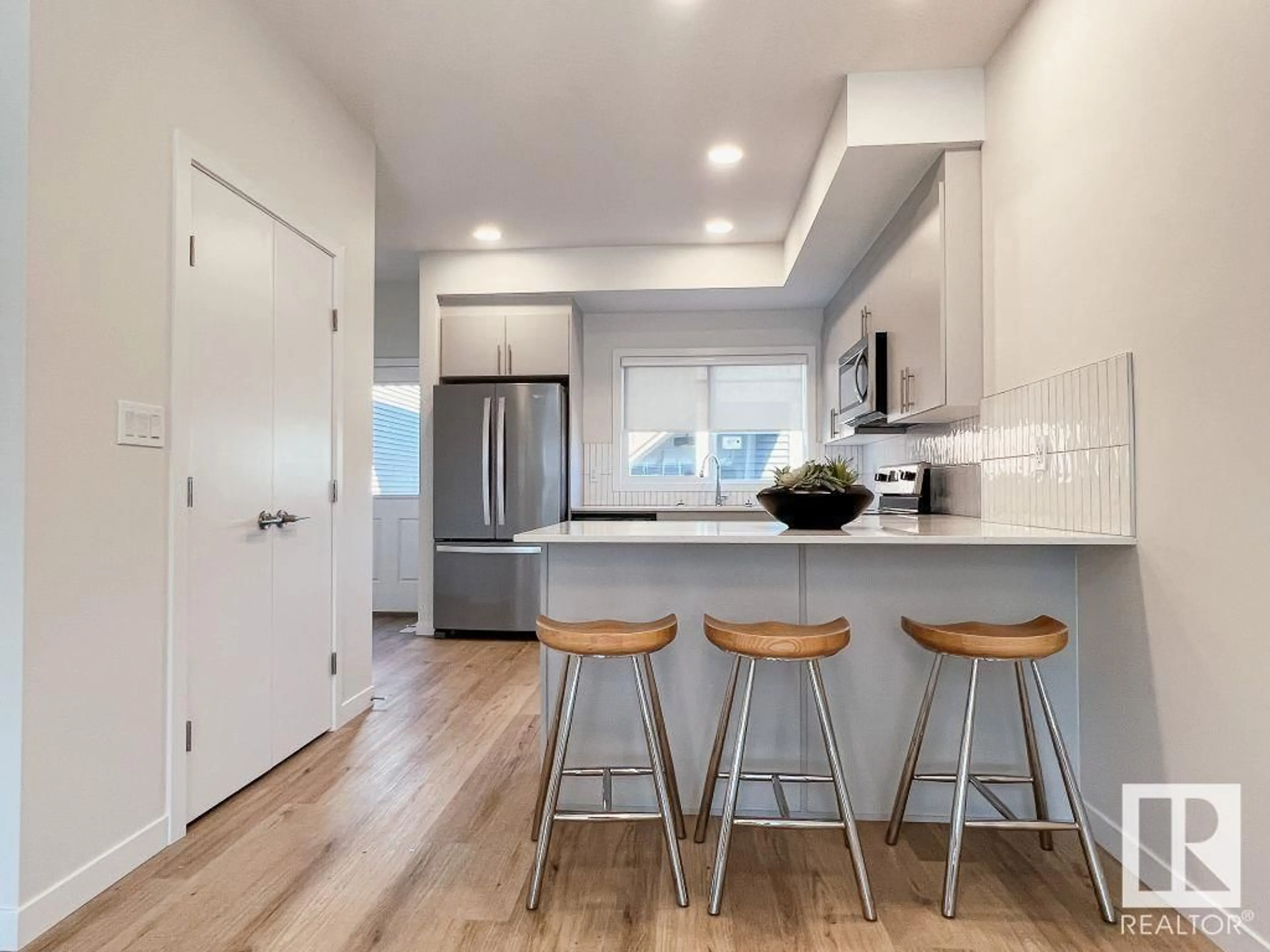Open concept kitchen, wood/laminate floor for 120 GARNEAU GA, Spruce Grove Alberta T7X2Y6