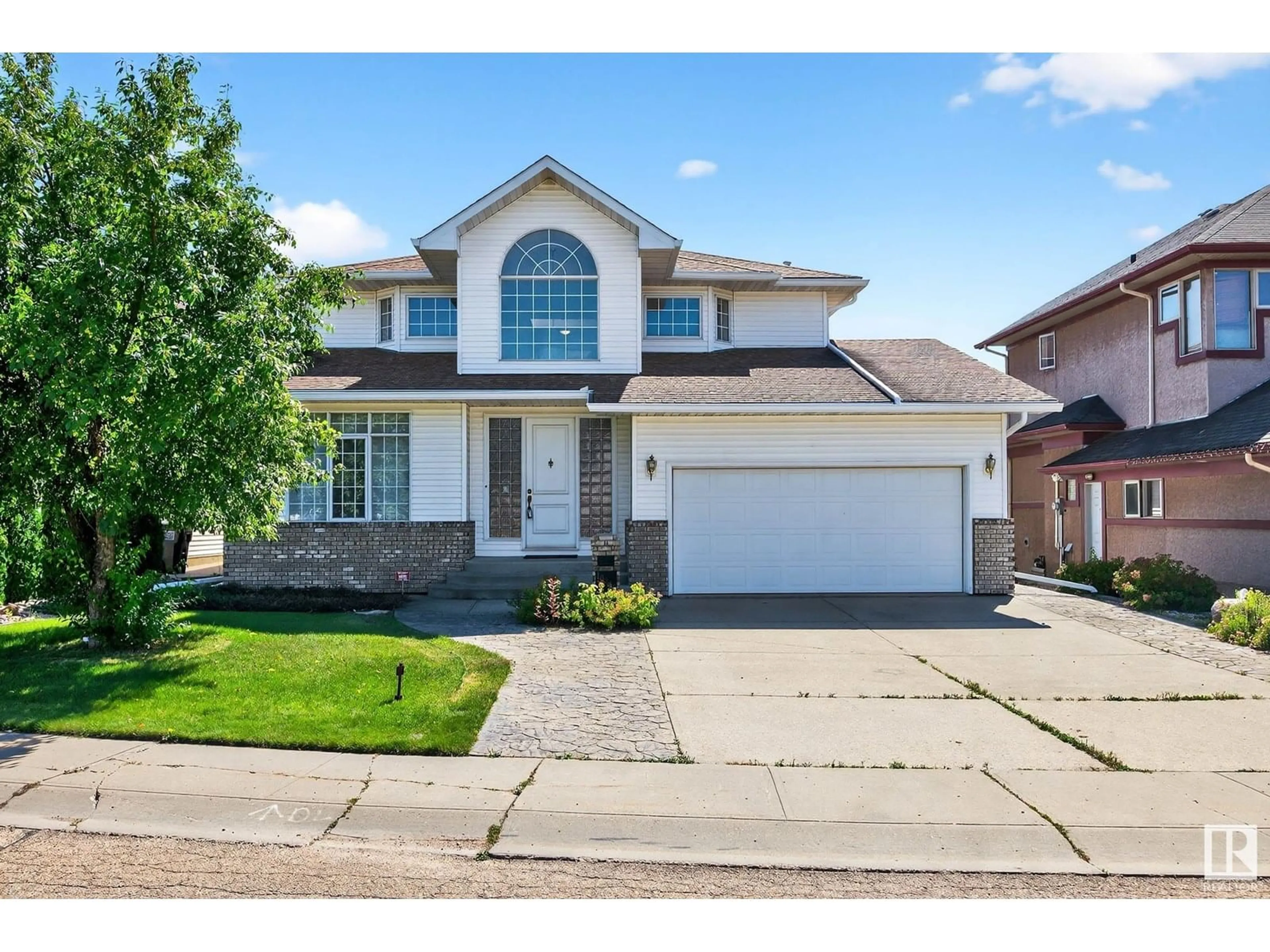 Home with vinyl exterior material, street for 10307 175 AV, Edmonton Alberta T5X5W9