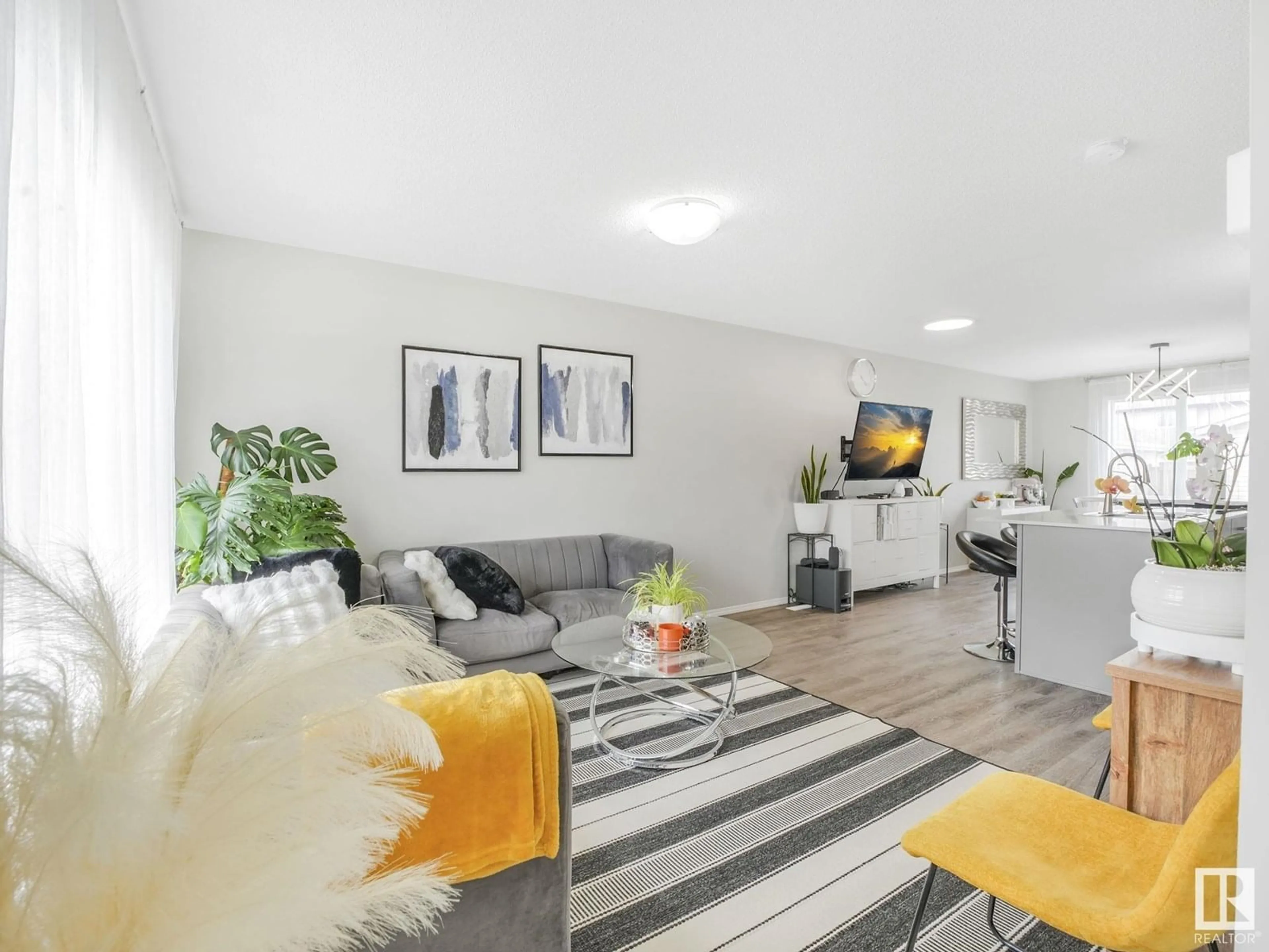 Living room with furniture, unknown for NW - 4684 175 AV, Edmonton Alberta T5Y3Z8