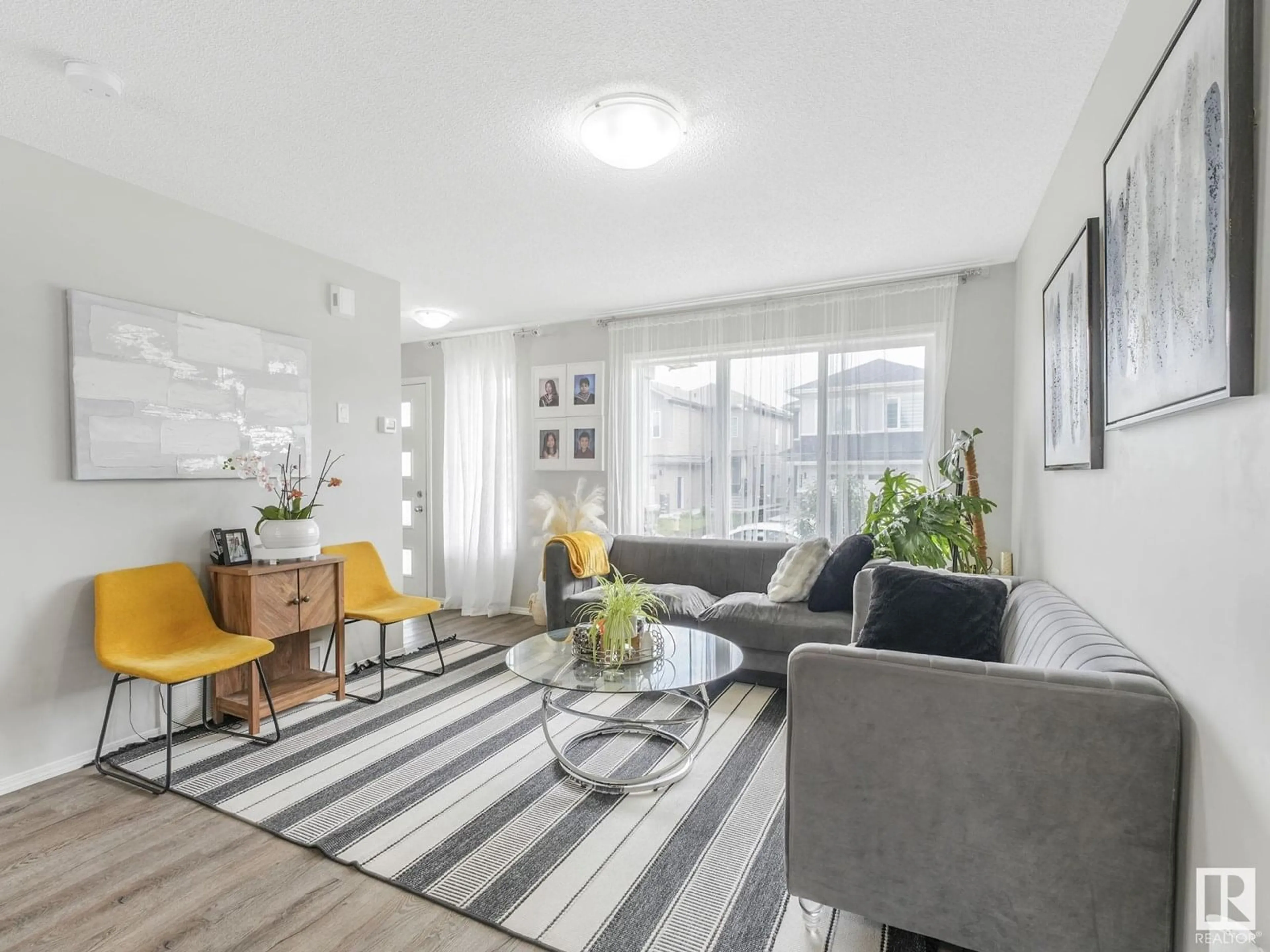 Living room with furniture, unknown for NW - 4684 175 AV, Edmonton Alberta T5Y3Z8