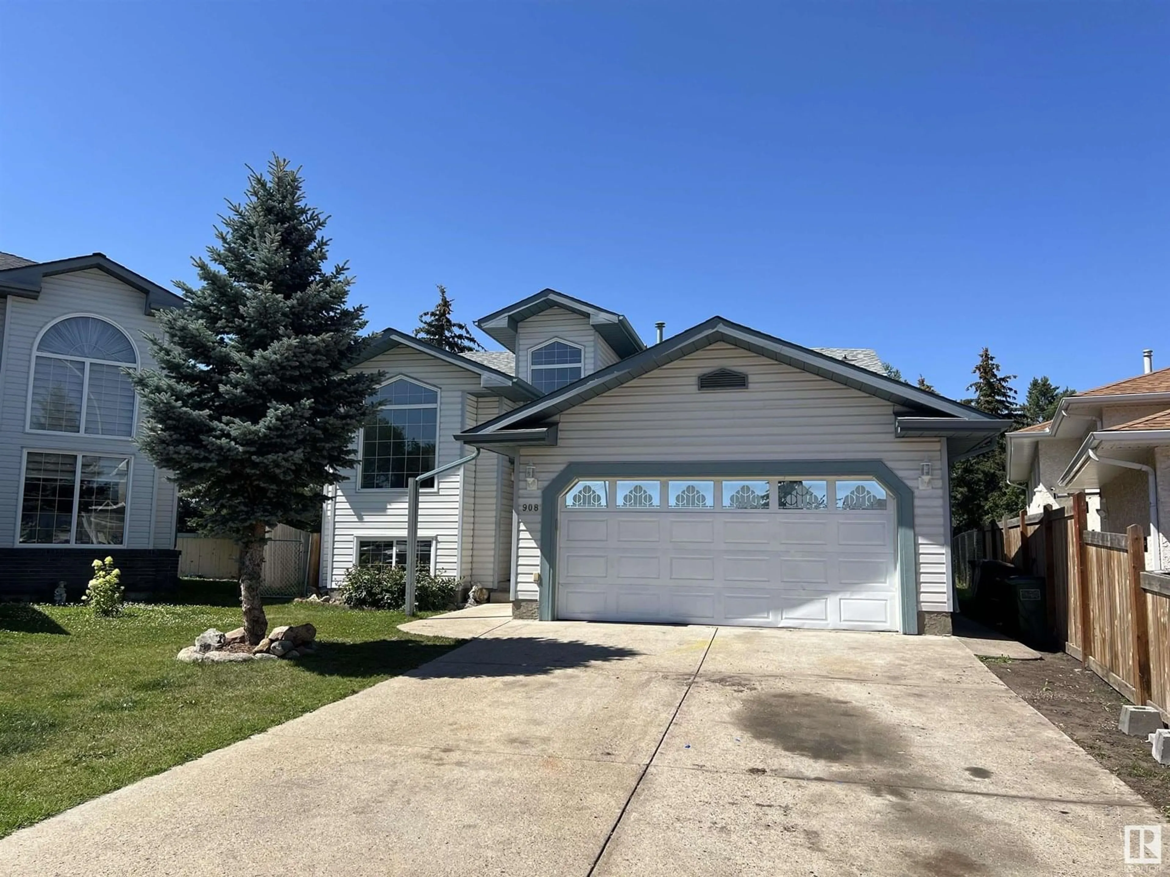 Home with vinyl exterior material, street for 908 JORDAN CR, Edmonton Alberta T6L6X5