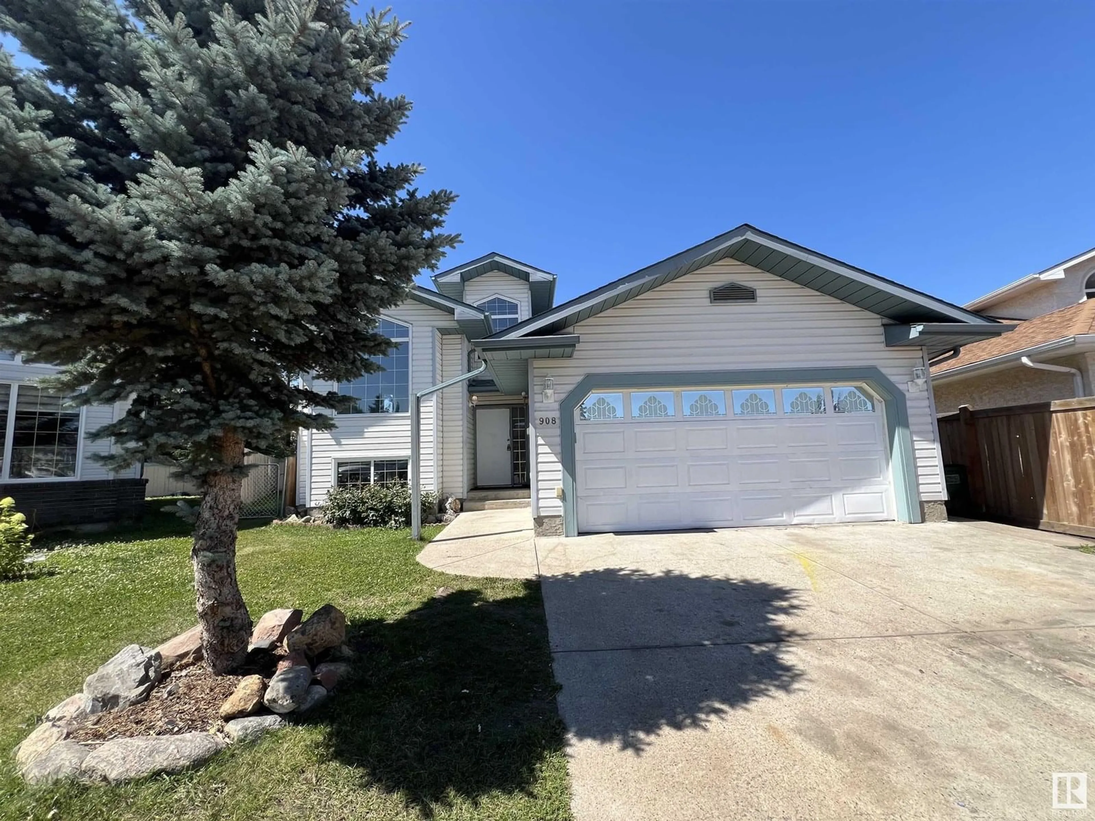 Home with vinyl exterior material, street for 908 JORDAN CR, Edmonton Alberta T6L6X5