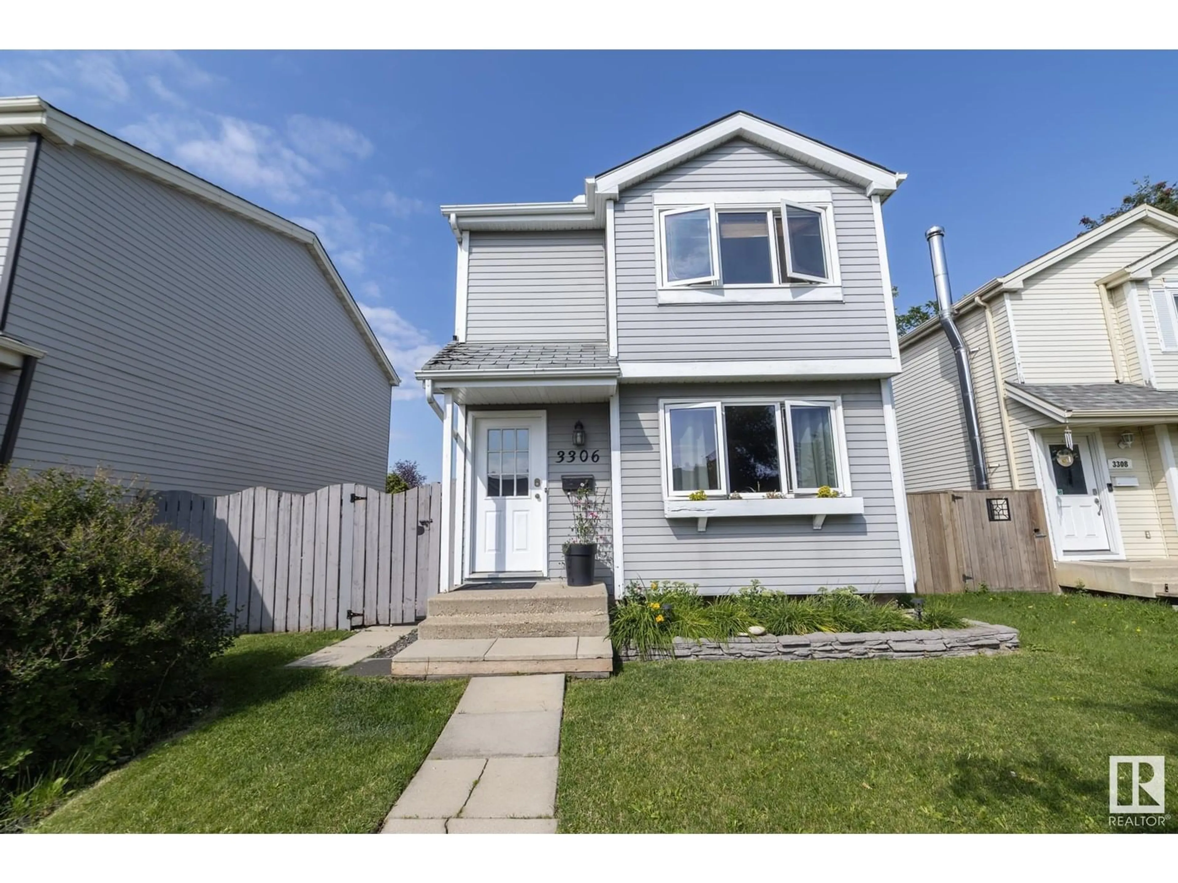 Home with vinyl exterior material, street for NW - 3306 48 ST, Edmonton Alberta T6L4J1