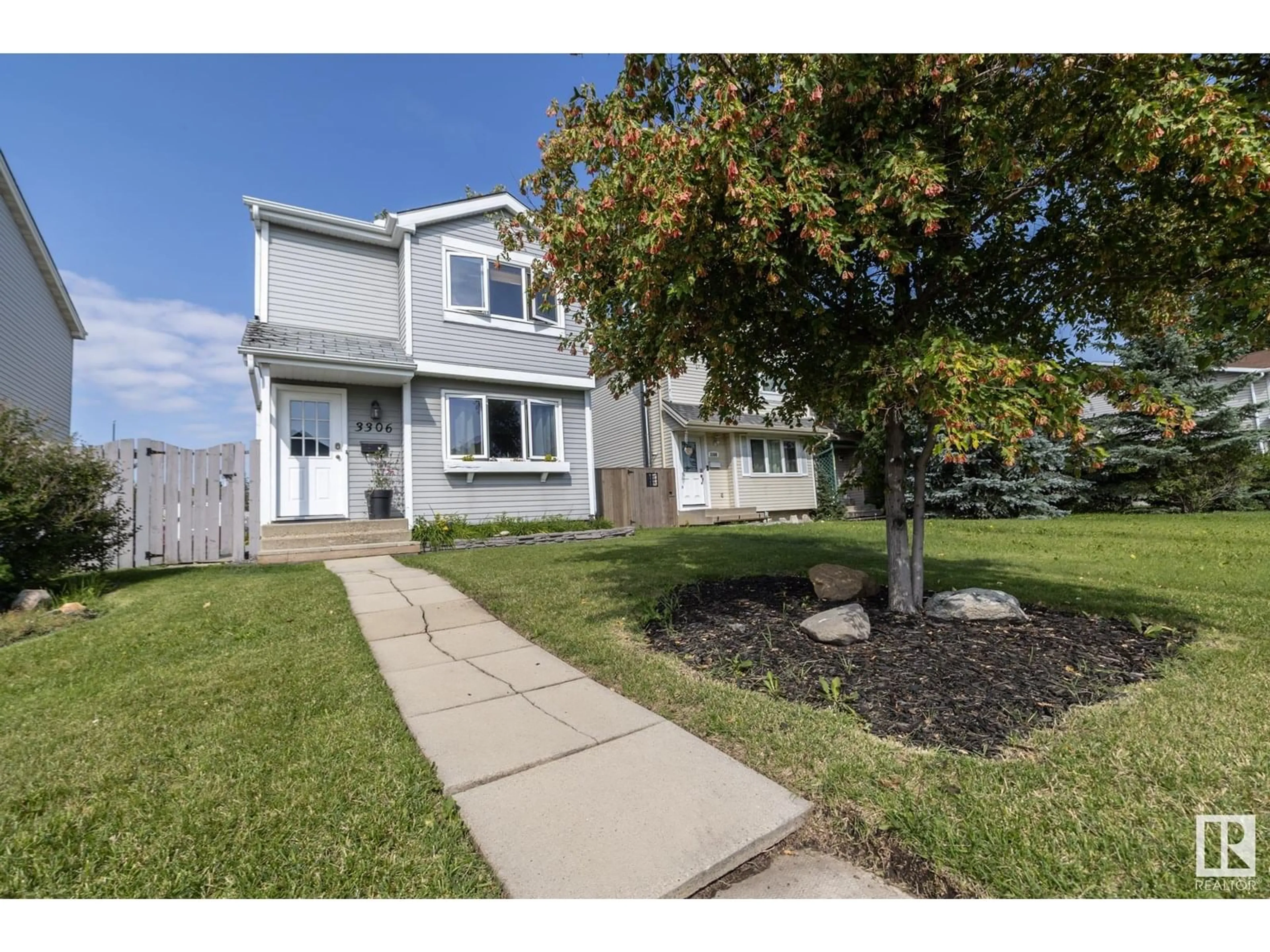 Home with vinyl exterior material, street for NW - 3306 48 ST, Edmonton Alberta T6L4J1