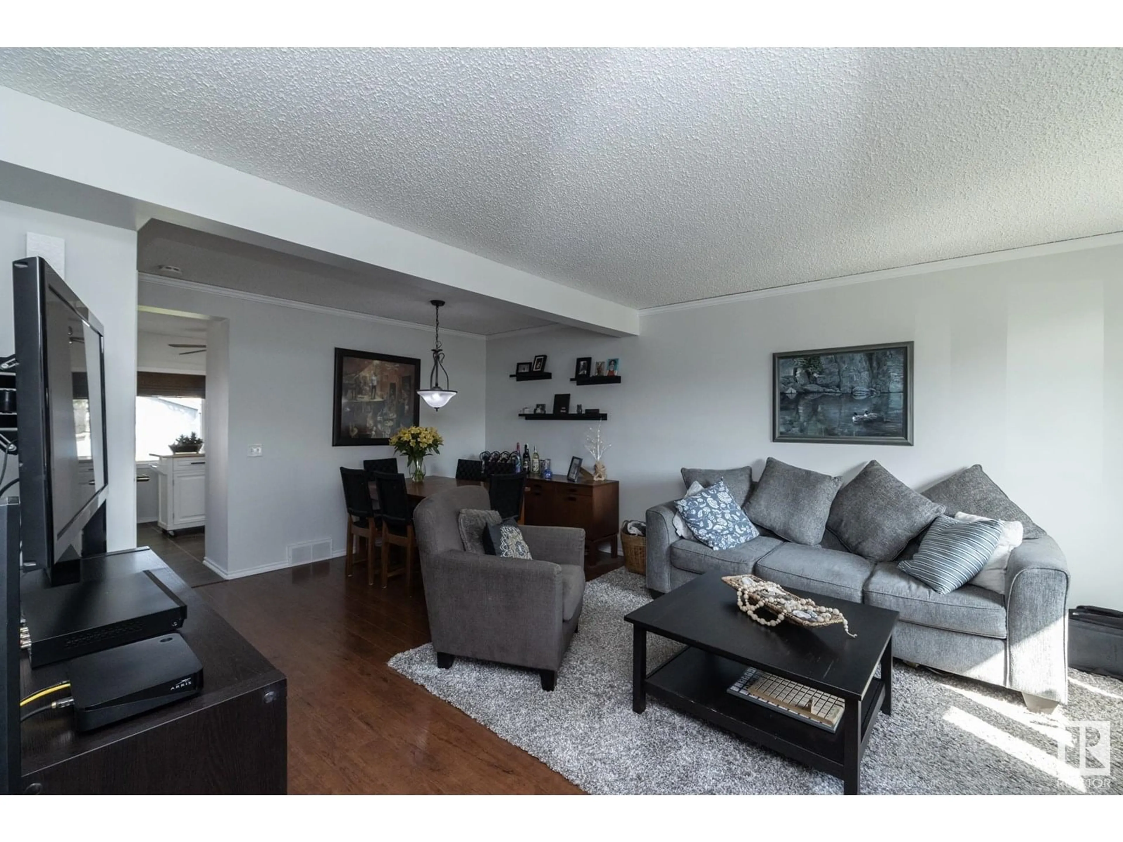 Living room with furniture, wood/laminate floor for NW - 3306 48 ST, Edmonton Alberta T6L4J1