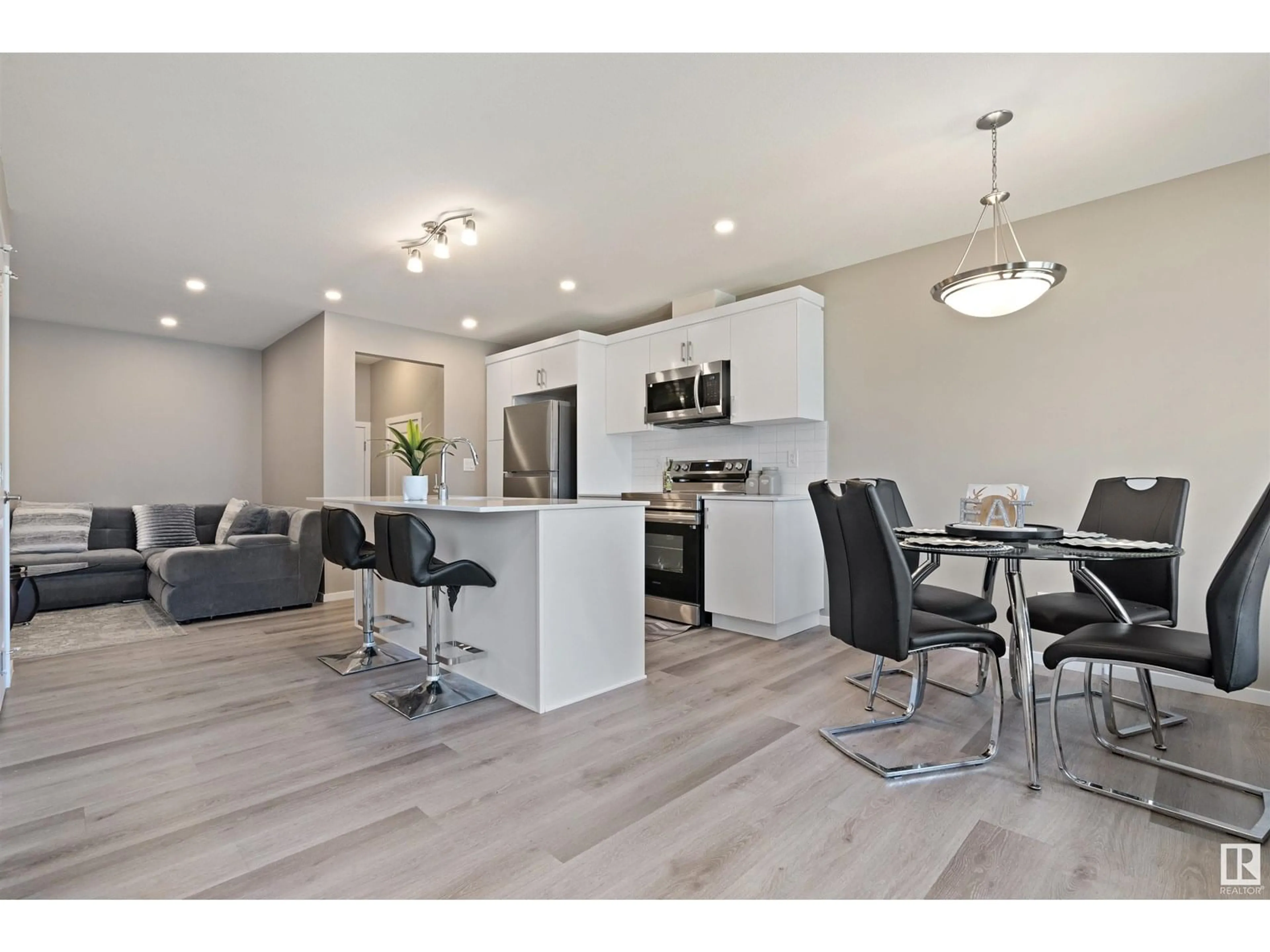 Open concept kitchen, wood/laminate floor for 1056 CRESTVIEW TC, Sherwood Park Alberta T8H3A3
