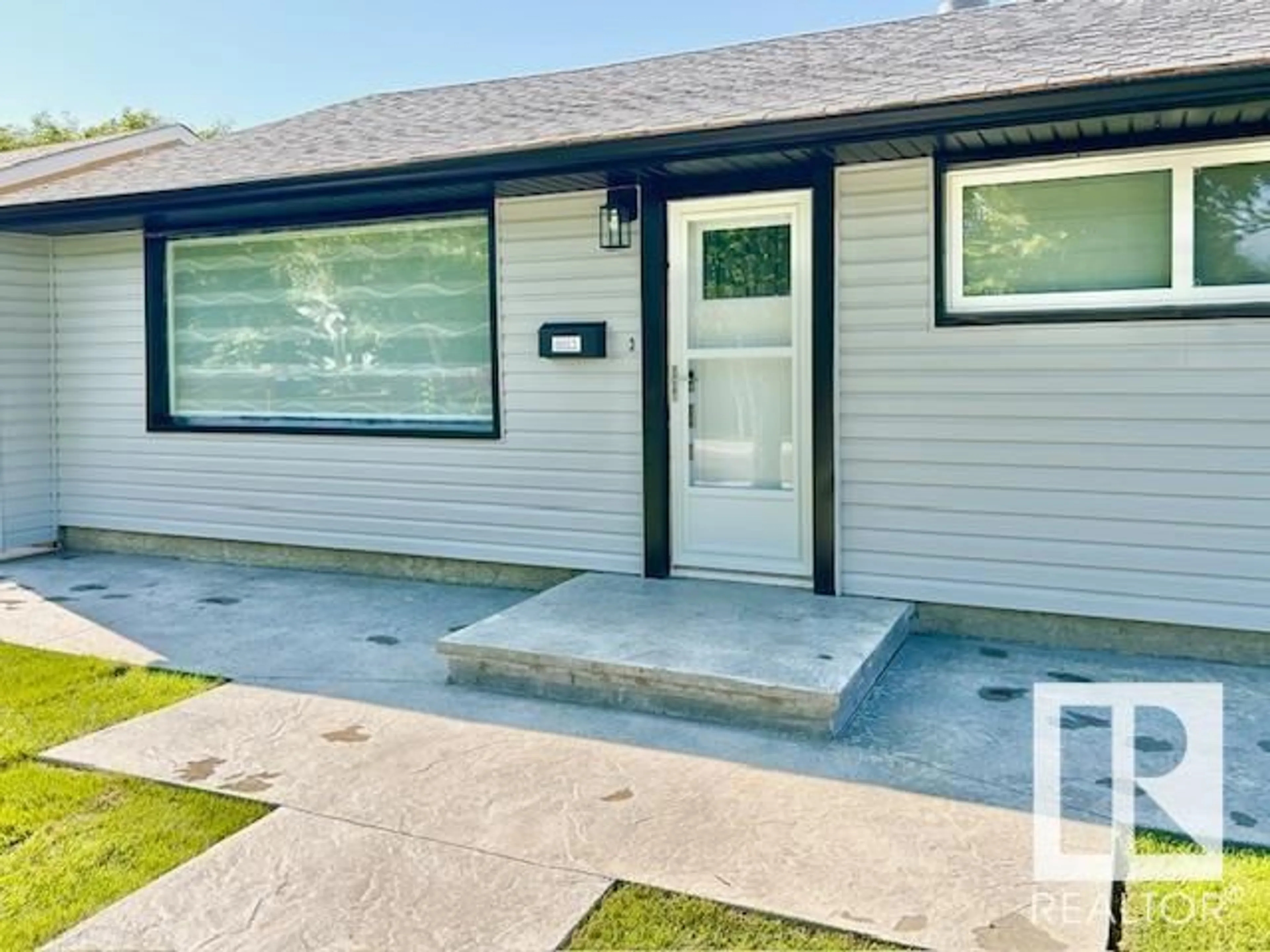 Home with vinyl exterior material, street for 8811 130A AV, Edmonton Alberta T5E0V7