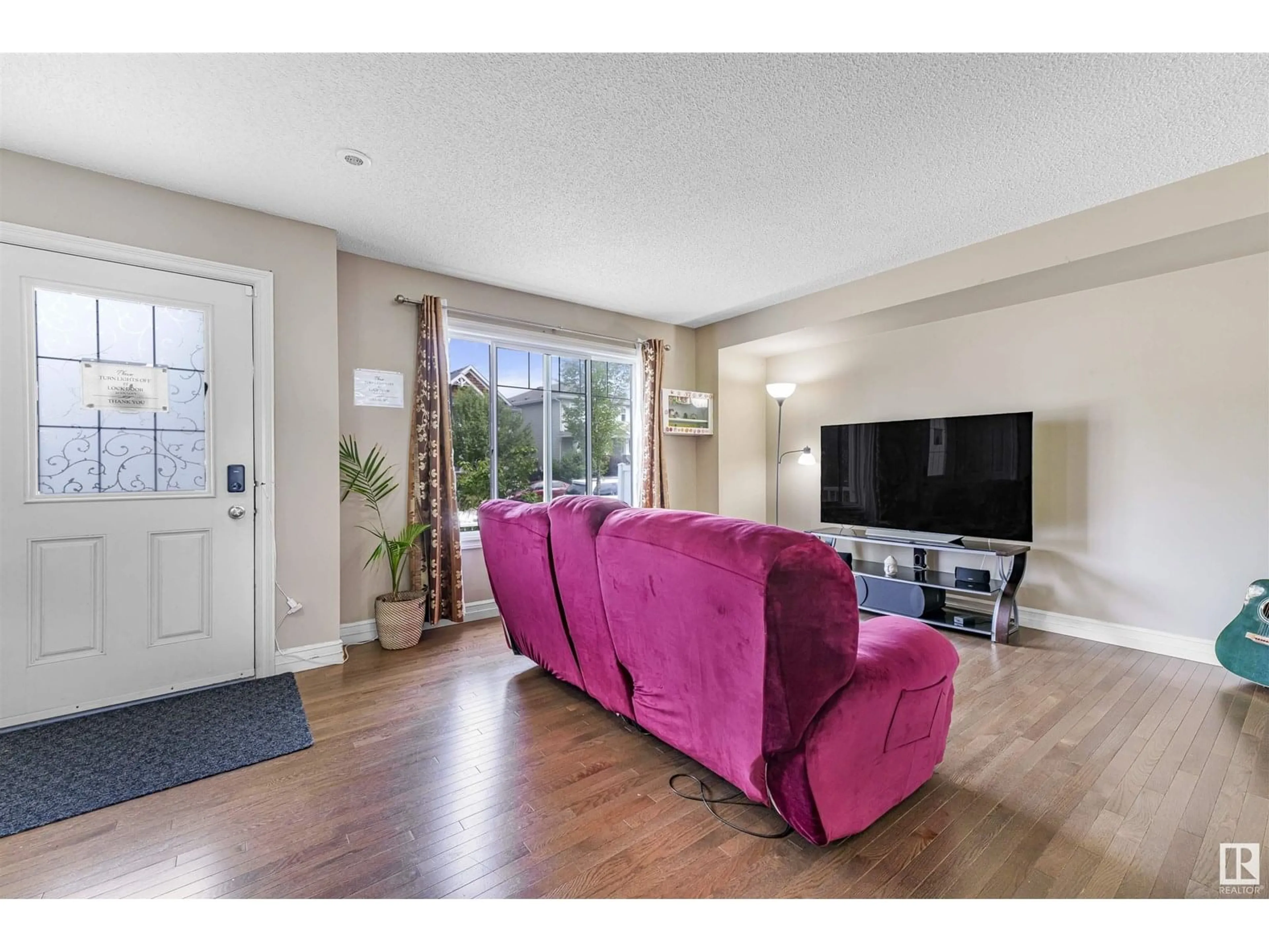 Living room with furniture, unknown for 5313 3 AV SW, Edmonton Alberta T6X0W7
