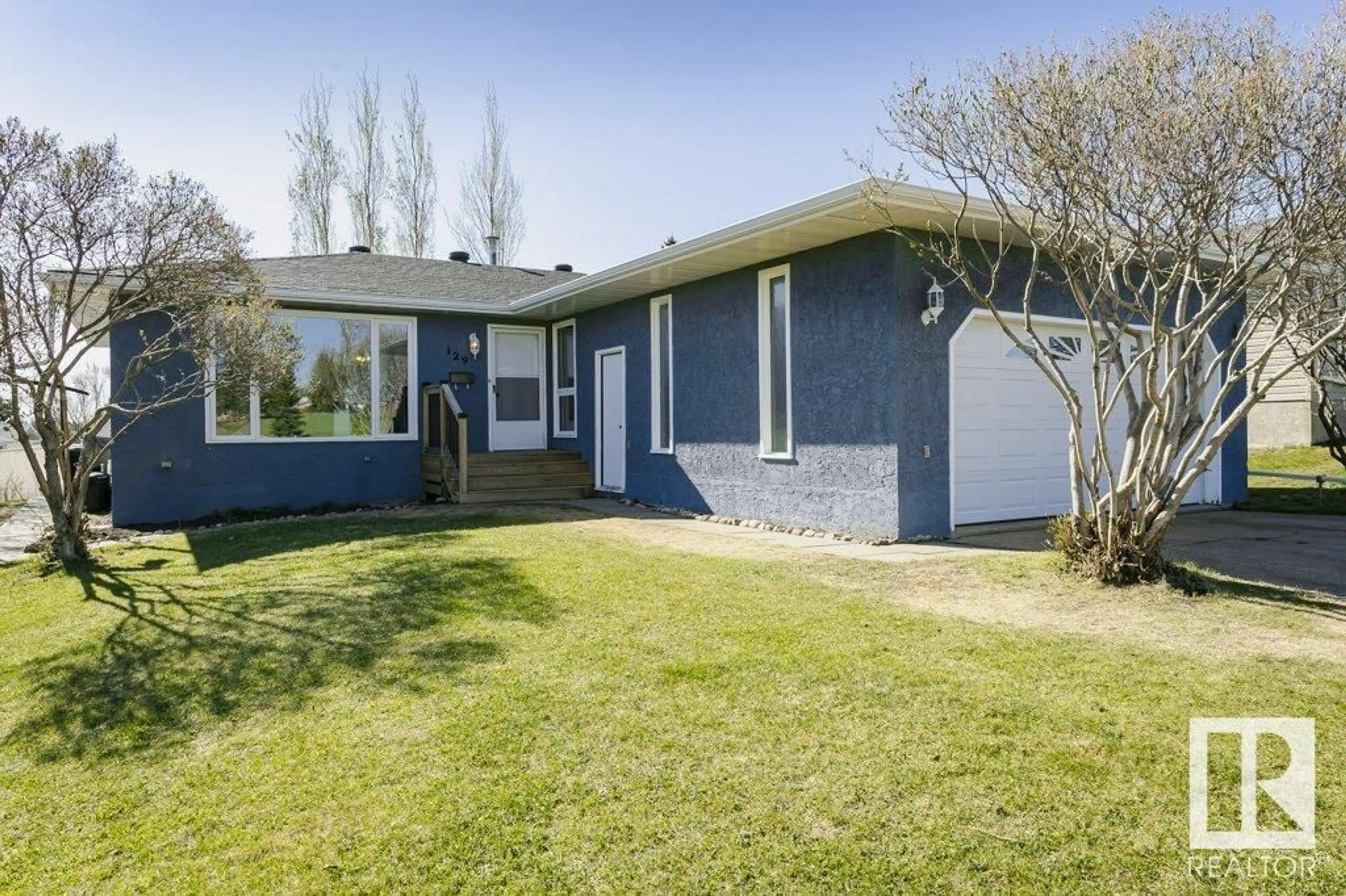 Home with vinyl exterior material, street for 129 DIAMOND DR, Millet Alberta T0C1Z0